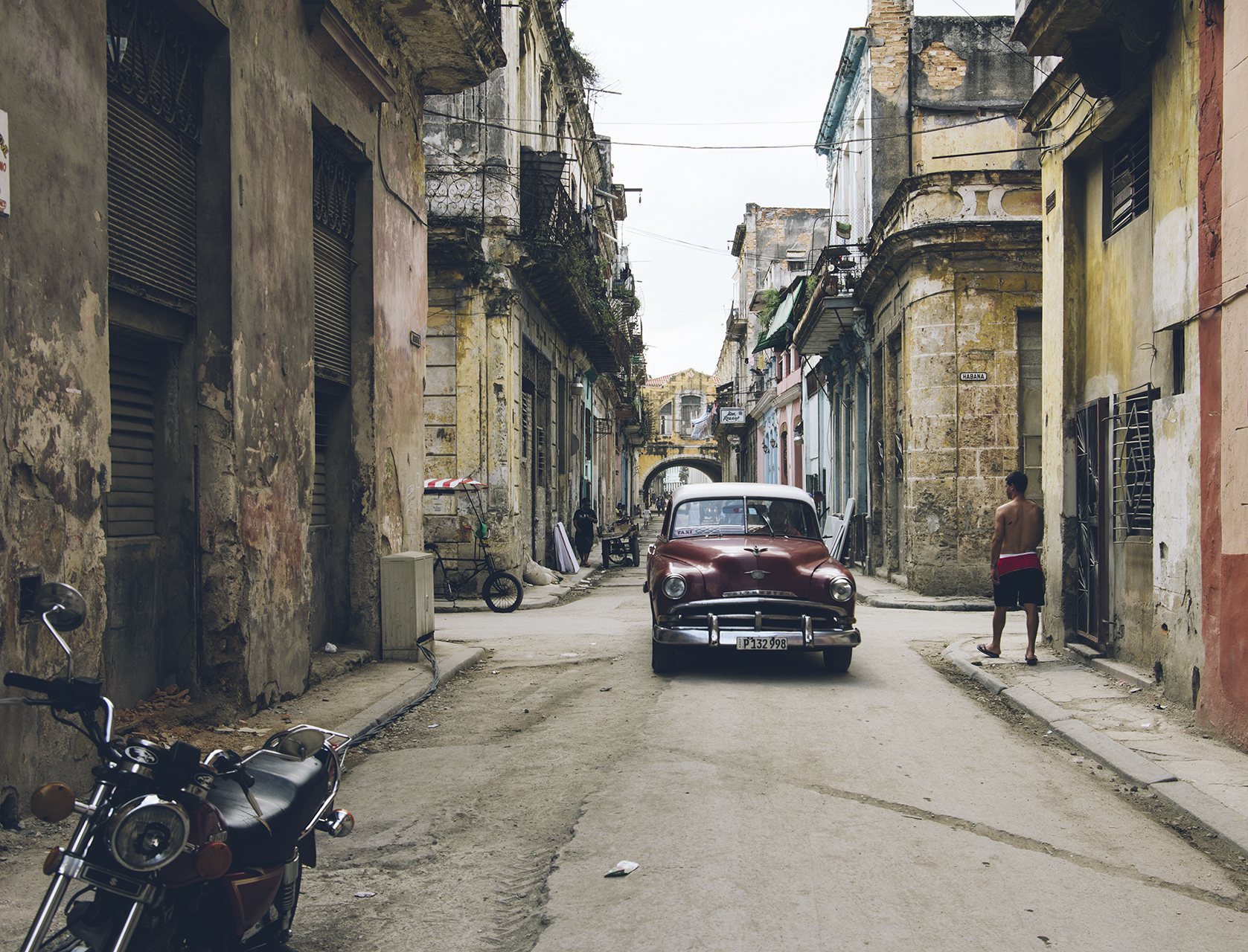  A 1953 Chevrolet lumbers through old Havana. 