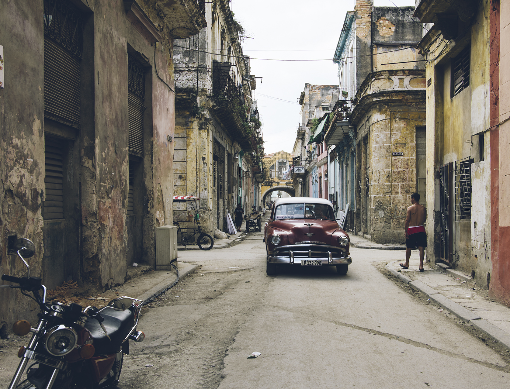 A 1953 Chevrolet lumbers through old Havana.