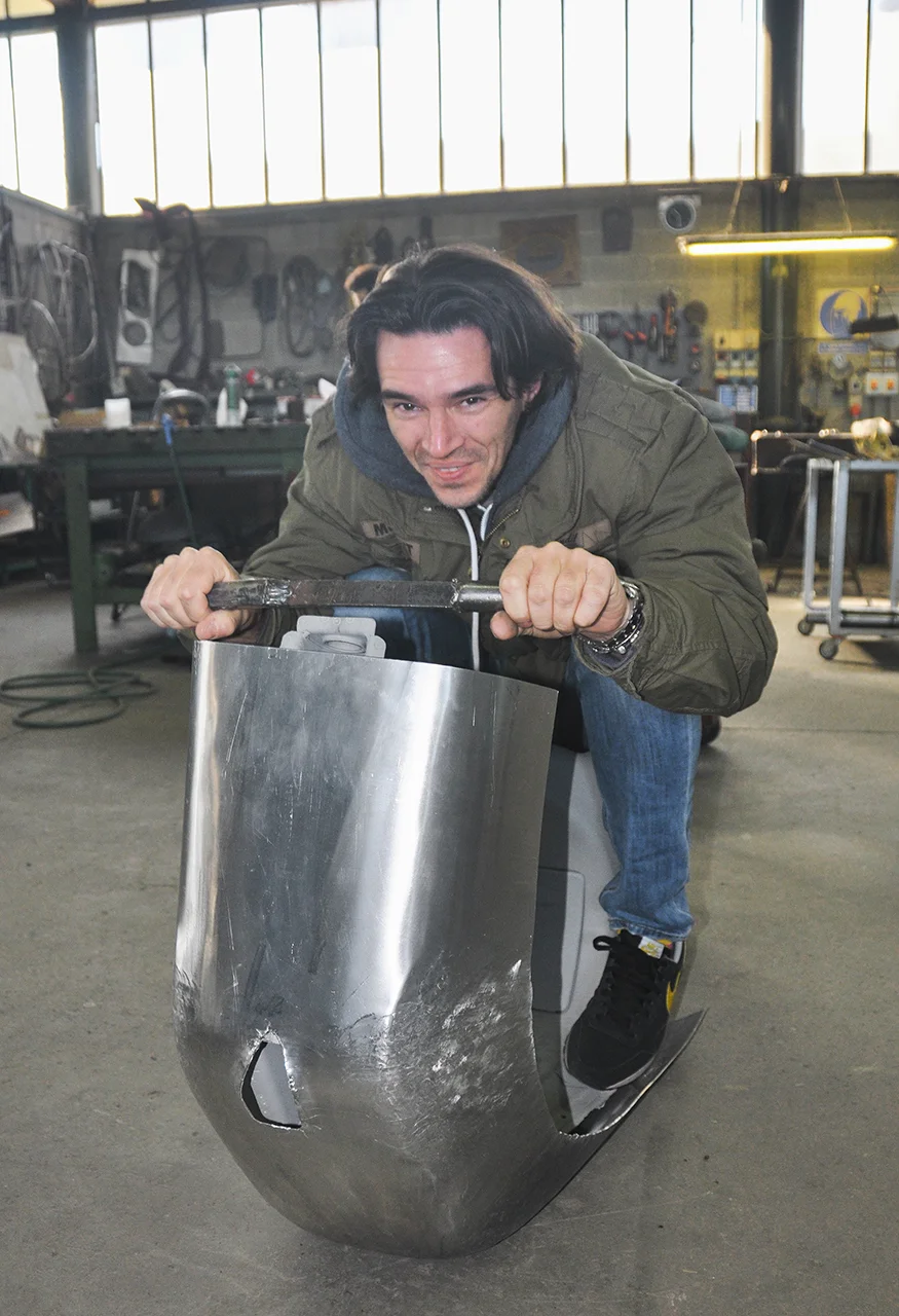 Marco Fumagalli tests out one of the Vespas during construction.