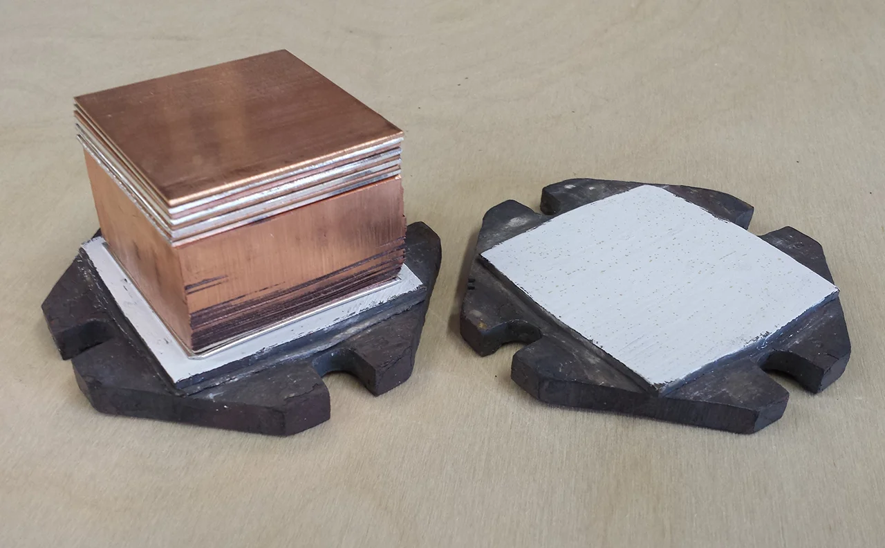 Fig. 10: Ribollita billet. The high temperature fused combination is in the center. Low temperature fusing layers are added on top and bottom to form the new billet.