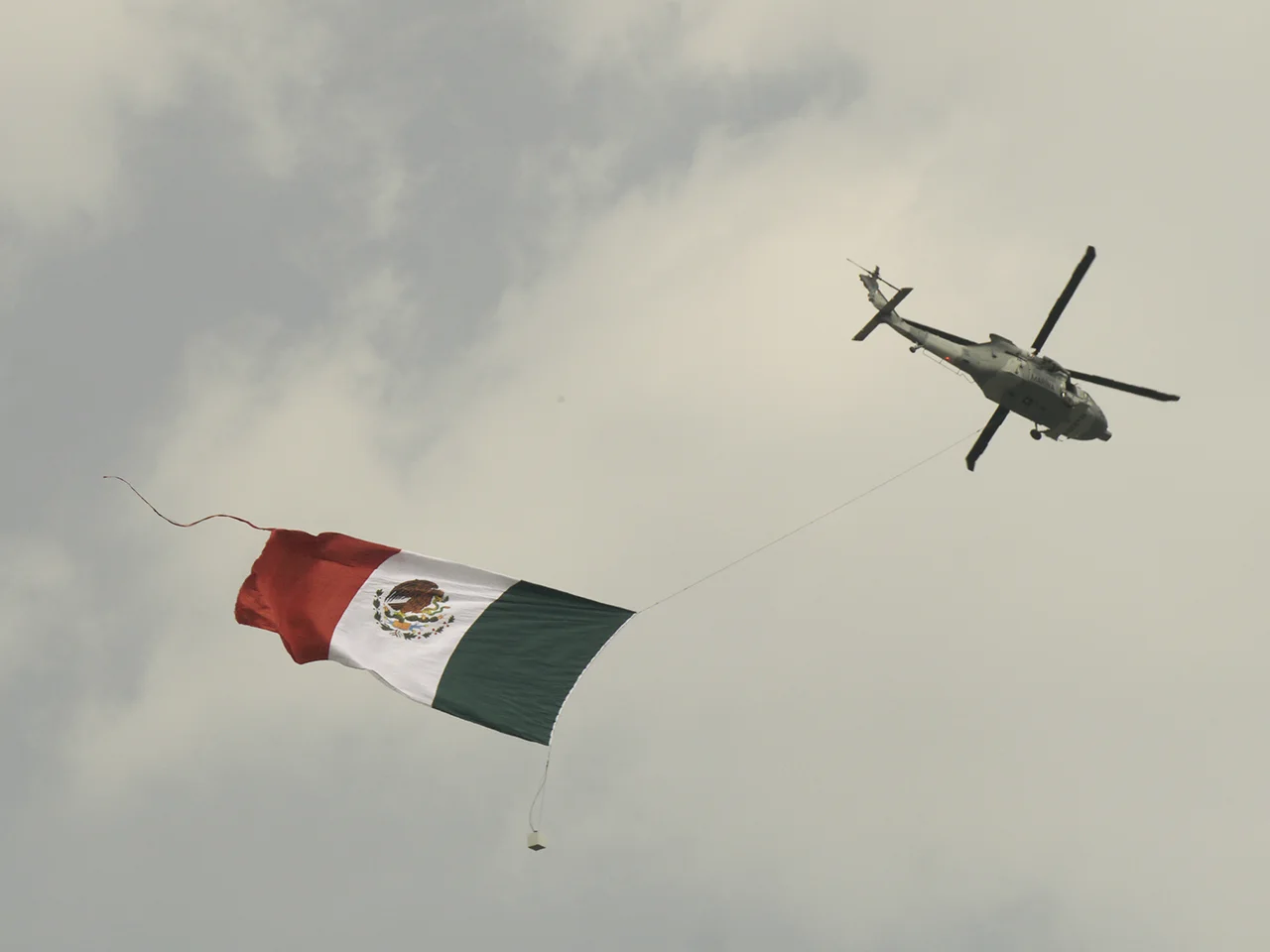 No fighter jets at this race, but a Mexican army helicopter did fly around a huge flag.
