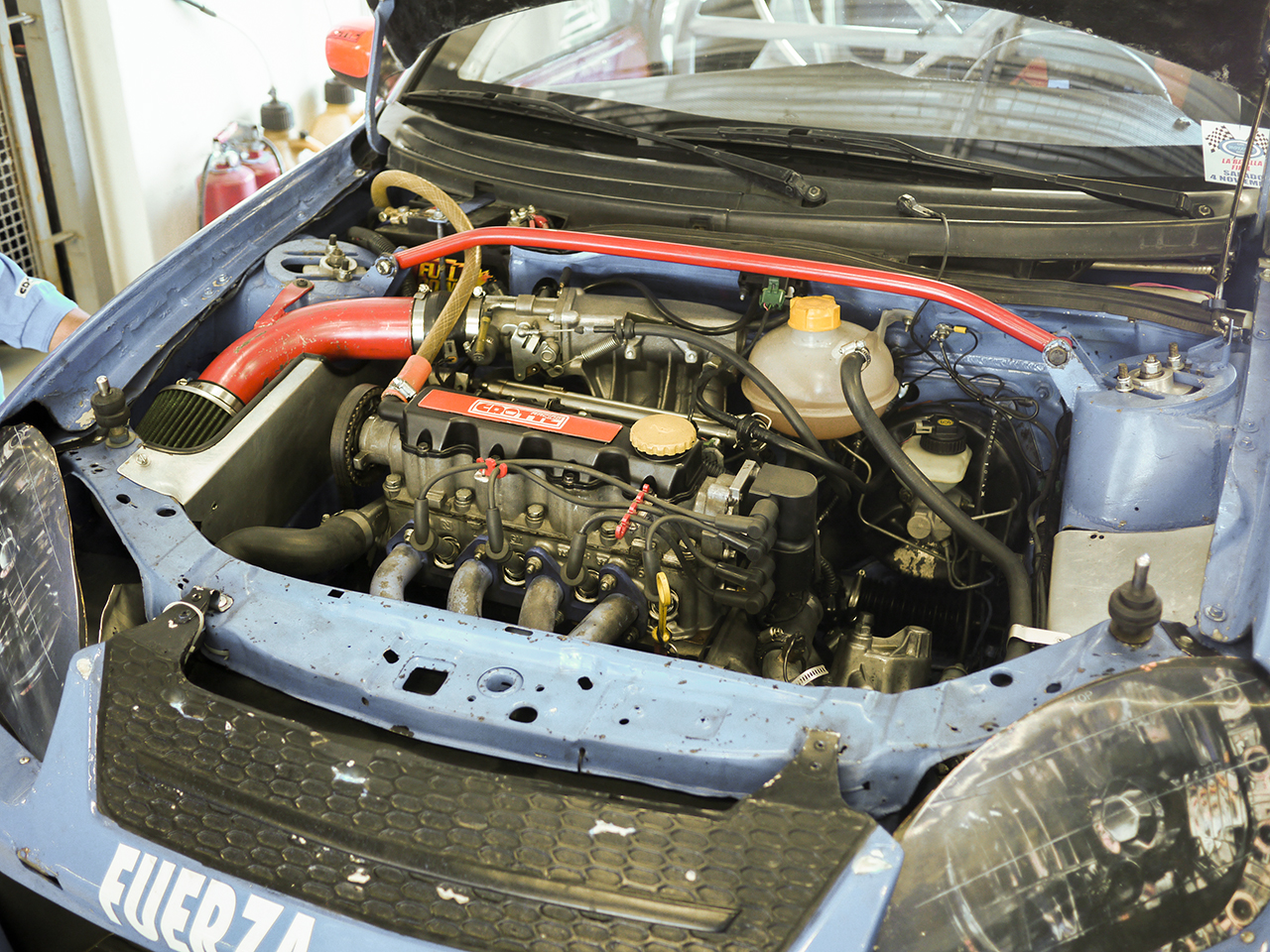 The engine bay of the Chevy. The power plant is a 1.8 liter engine from a Tornado truck. A model not available in the U.S.