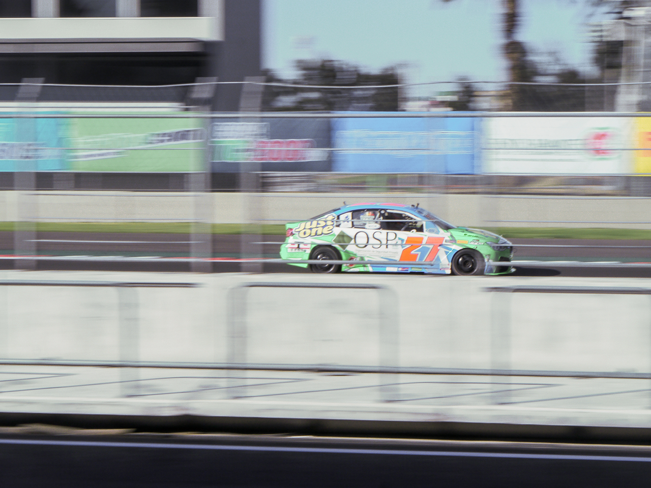 2.0 liter super touring car roars down the front straight.
