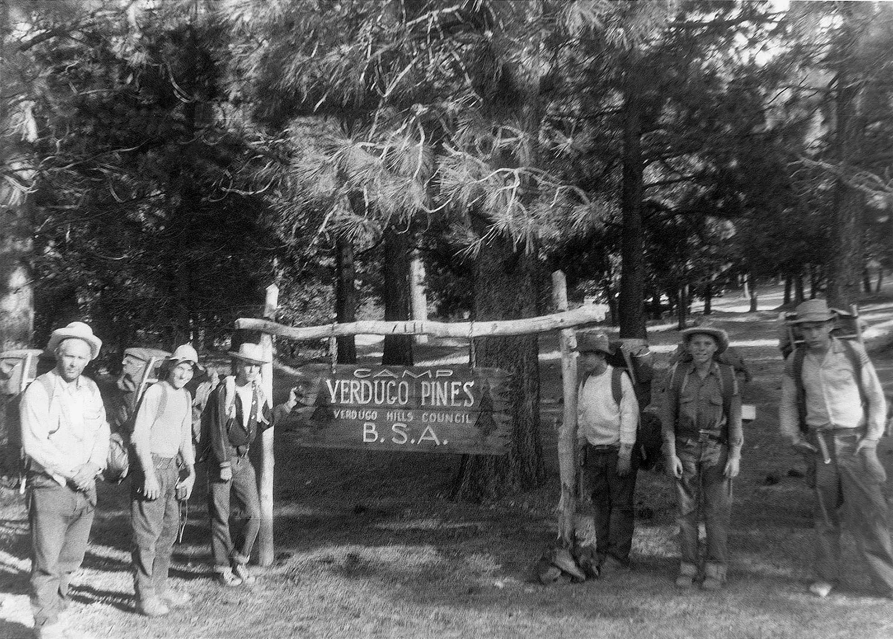 A group of Boy Scouts in 1956 on the Silver Moccasin hike, 60 miles from Crescenta to Verdugo pines. The author's brother Sterling is on the far right. Scout leader and family friend Dr. Millard Olney is on the left. Olney and some of the scouts are using early Kelty packs. The others are using Kelty pack frames with homemade pack bags.