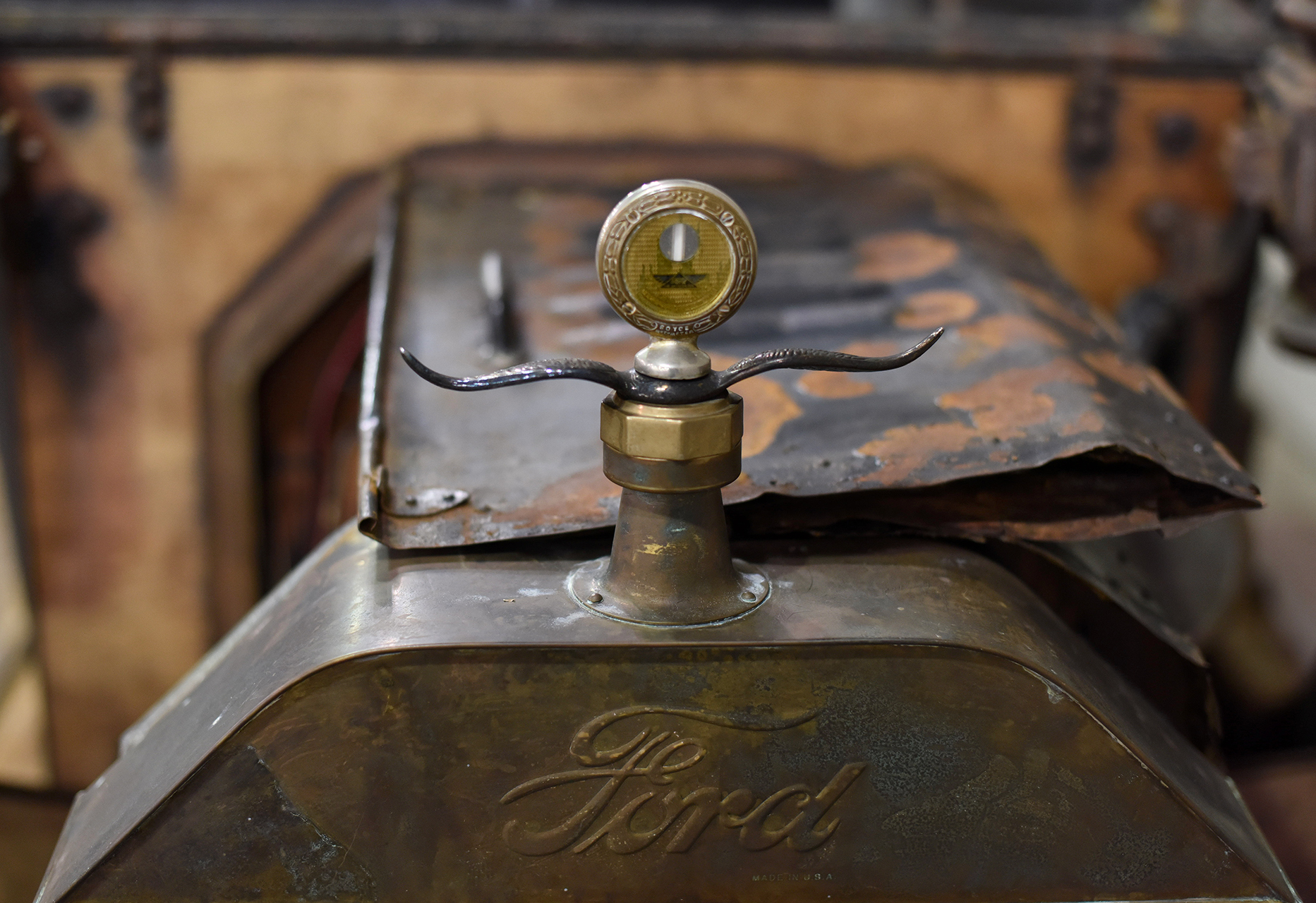  This accessory temp gauge looks elegant in worn brass and nickel against a background of rust. 