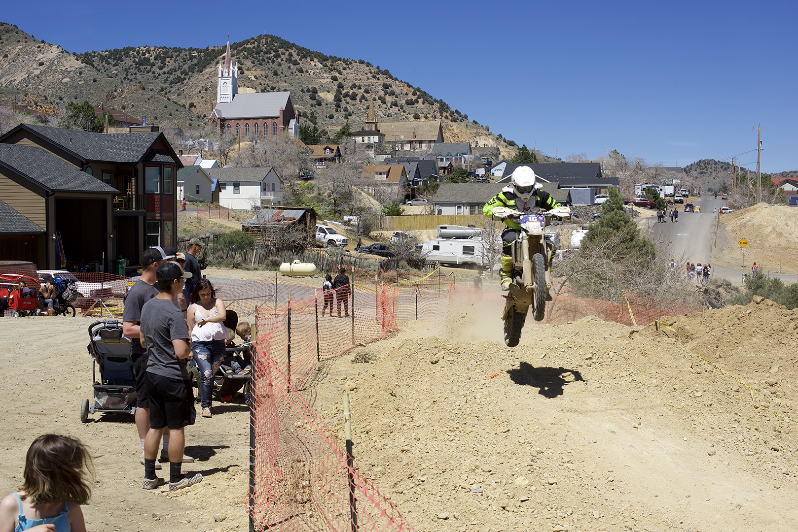  The course comes in to town in a couple places and spectators can get as close a look at the racing as they want to. Willy Heiss gets it going past the pits. 
