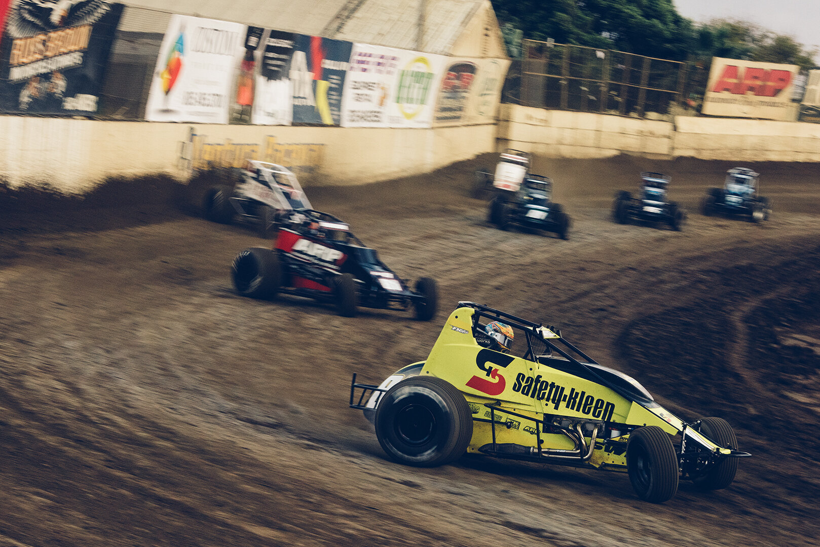  Pulling double duty, 2019 USAC Midget champ Tyler Courtney leads his sprint car heat race into turn three. 