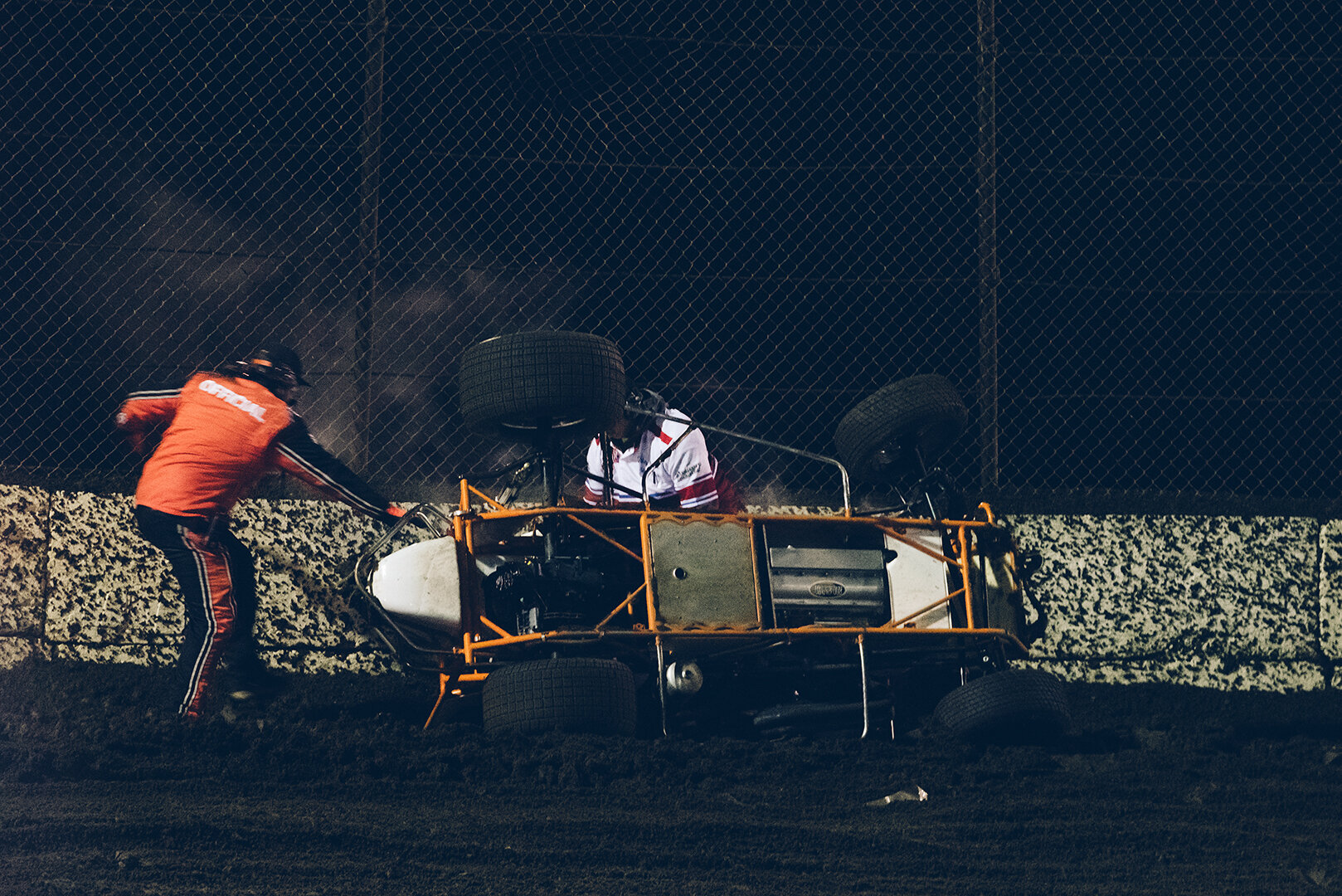  With just a few laps to go in the midget main, Tyler Courtney flipped wickedly before stopping at the entry to turn one. Driver was a-ok. 