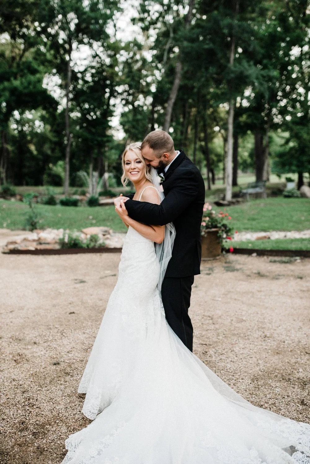 Groom hugging bride at Hidden Waters Event Venue