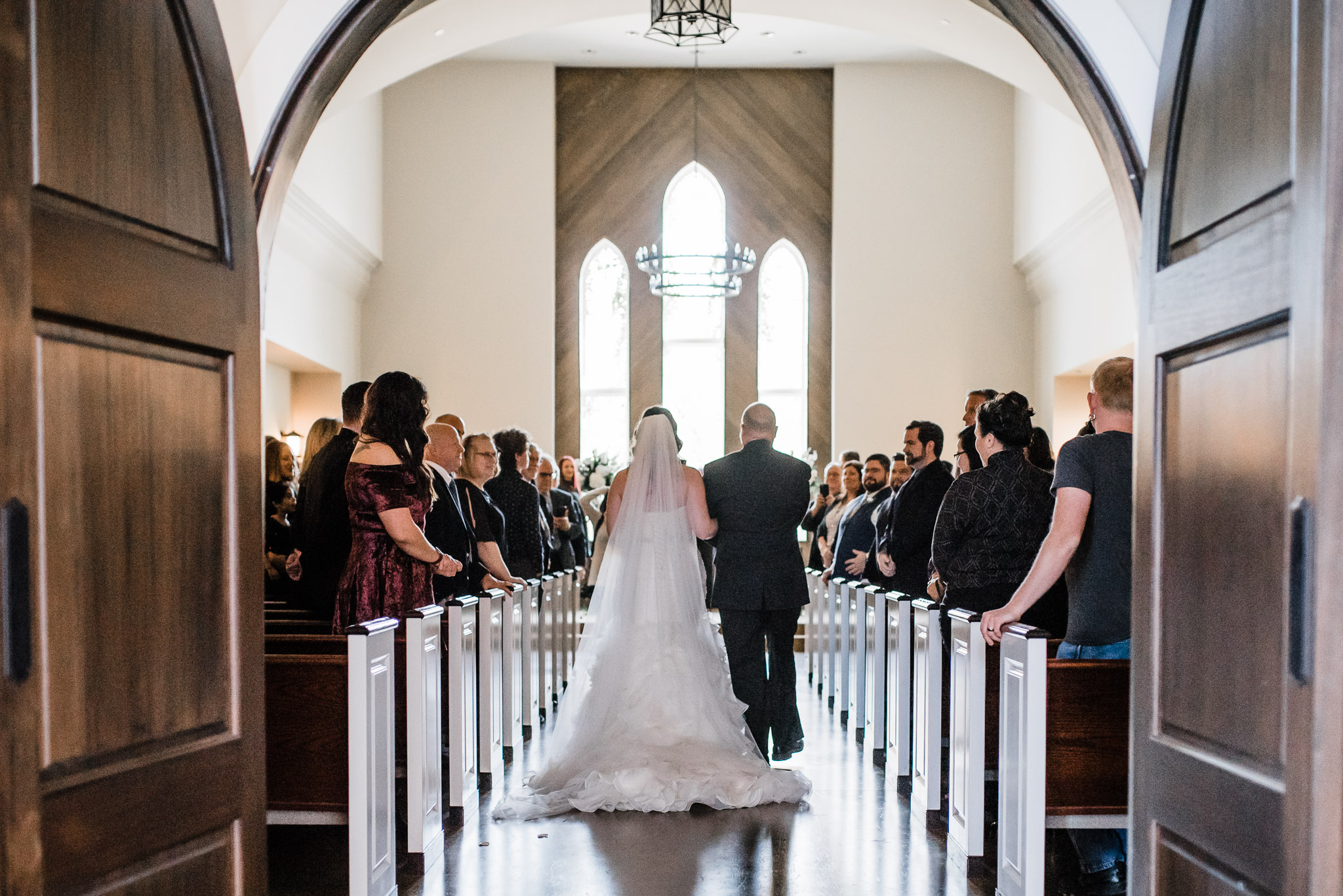 Father and Bride walk down the Isle of The Widsor Church 