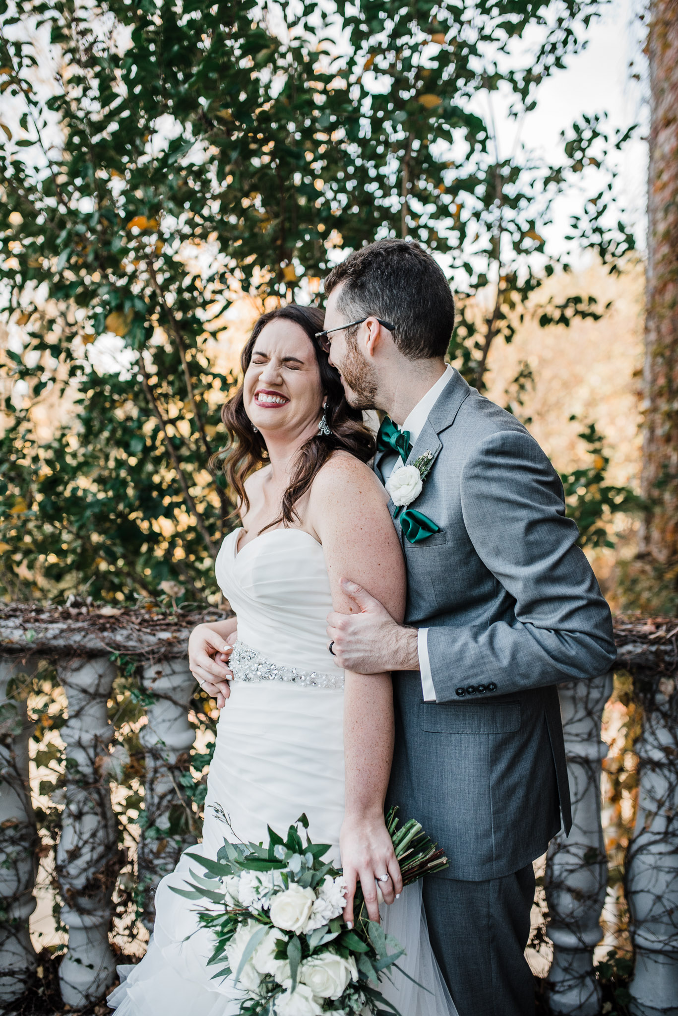 Groom holding his new wife and luaghing 