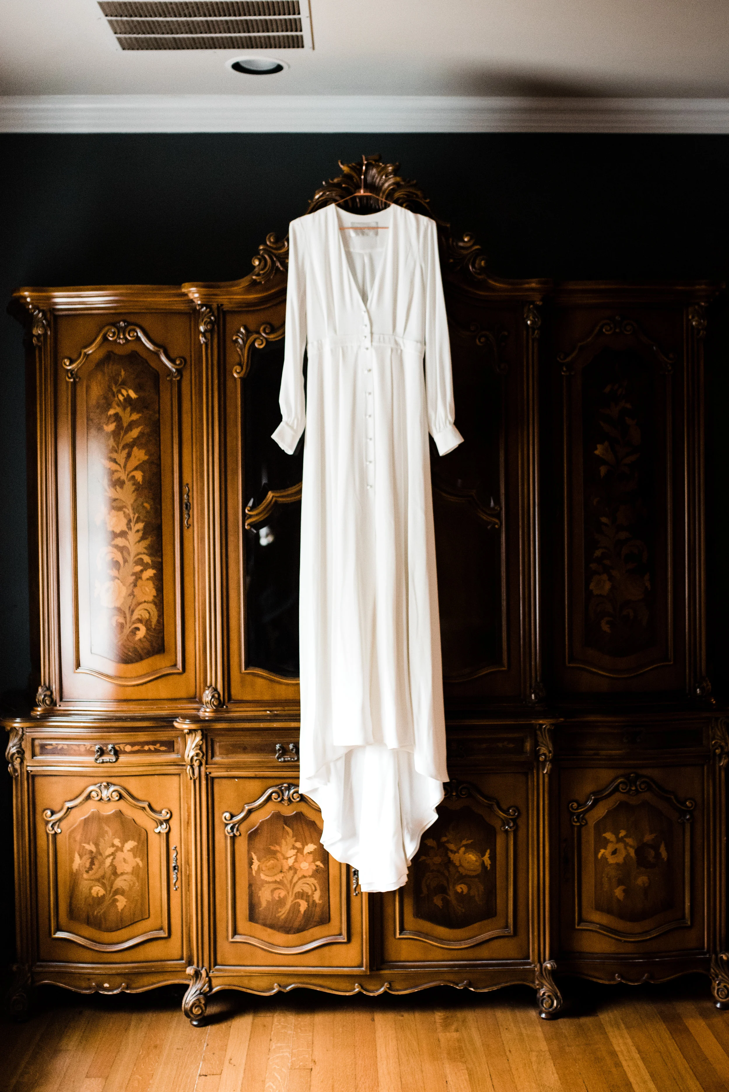 Wedding dress hanging at a Fort Worth AirB&B