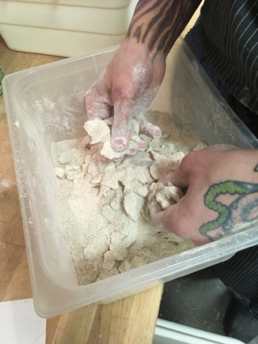rubbing butter into the flour