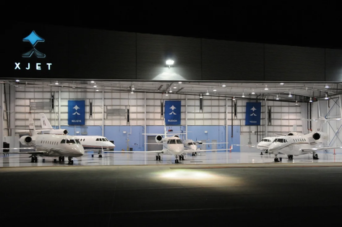 XJetSign&HangarAtNight.jpg