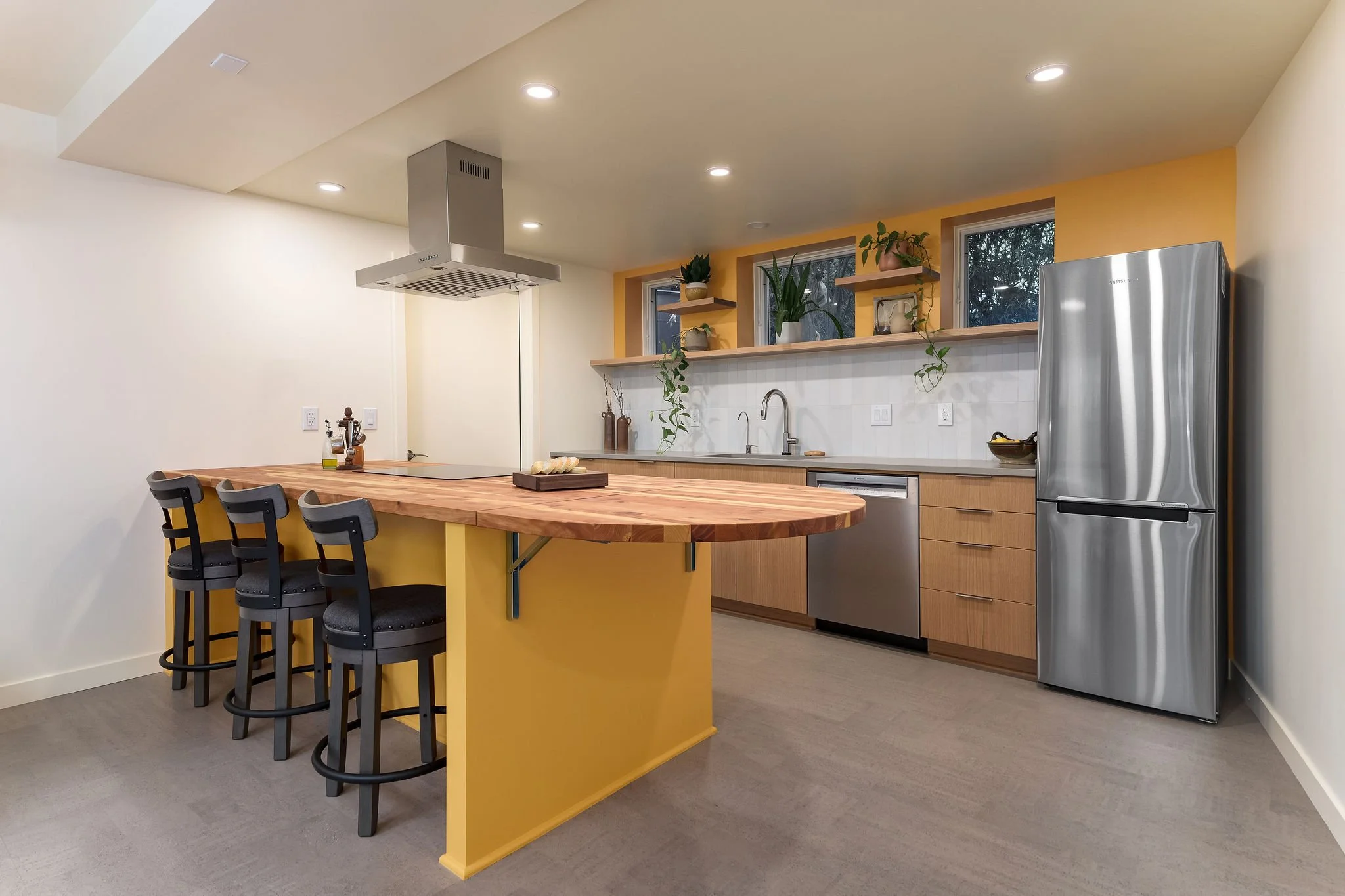 New kitchen with butchers block and yellow accents