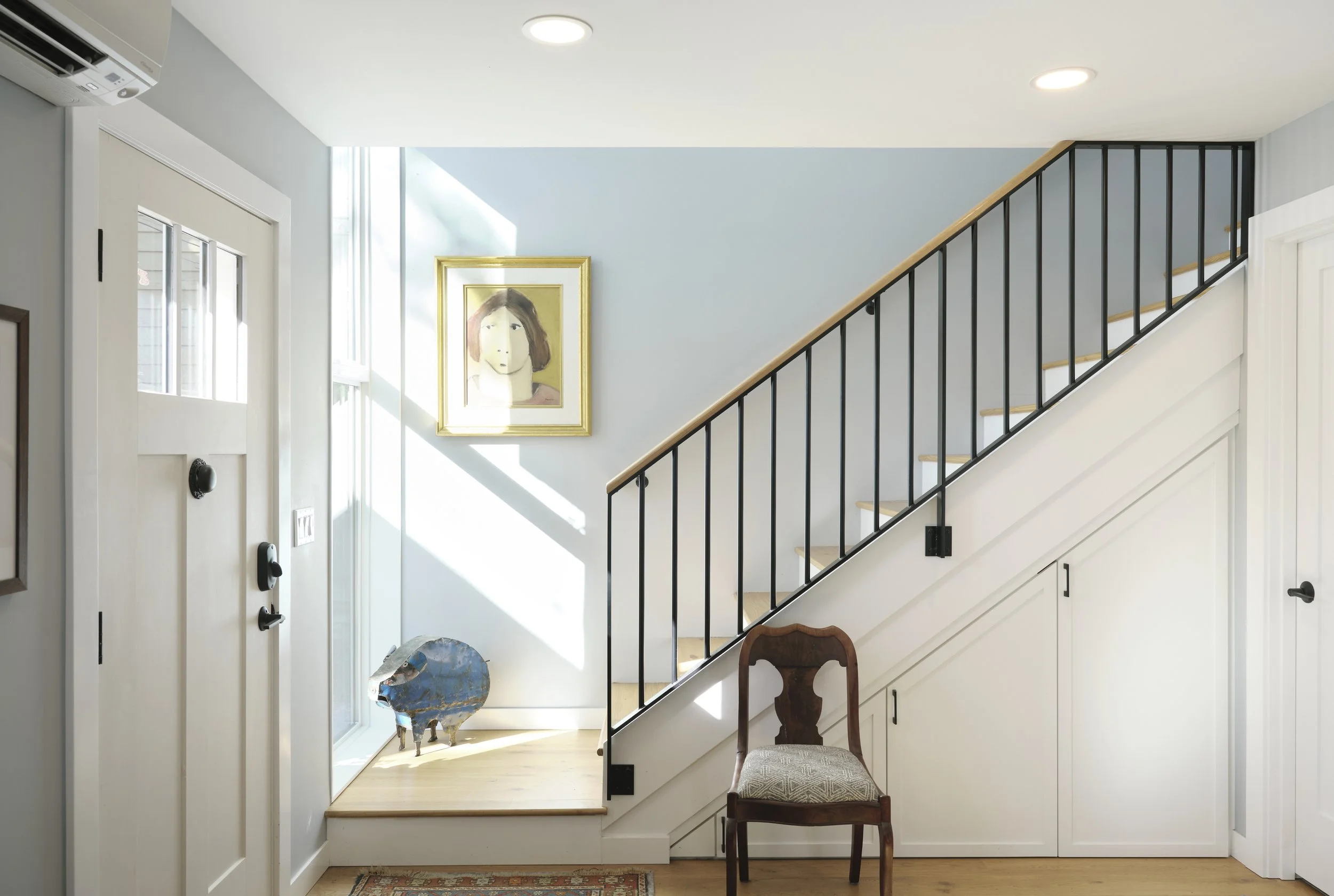 Stairway with light coming through windows