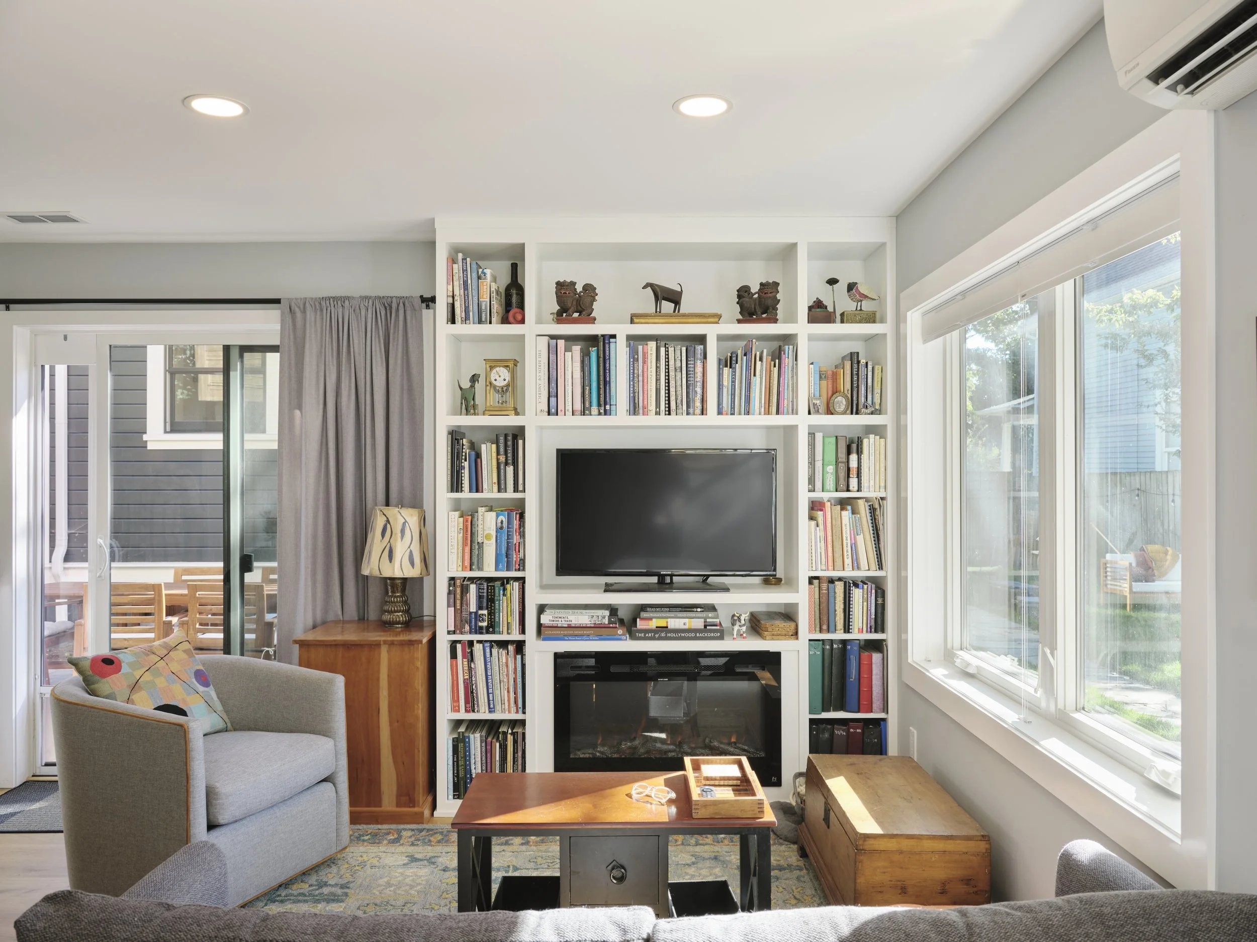 Built in bookshelves with large windows on all sides