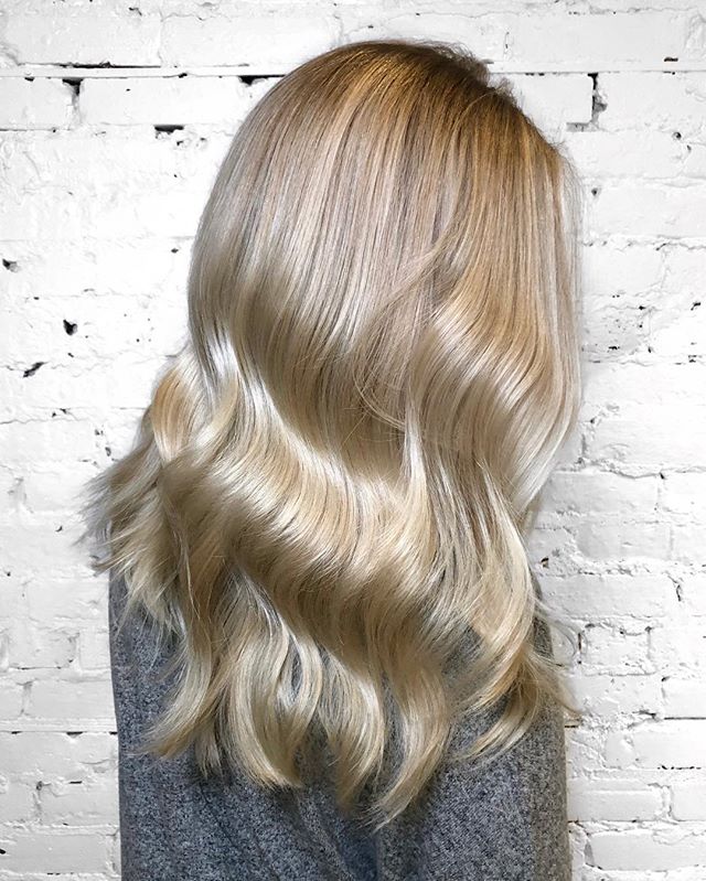 Bright platinum balayage to get ready for spring and summer! This color took several sessions to achieve and there is @olaplex in every step to keep the hair healthy. @refstockholm Cool Silver Shampoo would be a perfect option to keep this shade at h