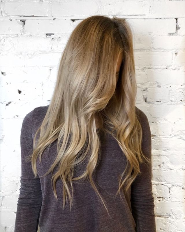 Balayage with root smudge glaze! This is a great technique for a low maintenance blonde look that only requires touching up every few months. Silver shampoo is recommended for low maintenance blondes to keep the cool tones in the hair between visits.