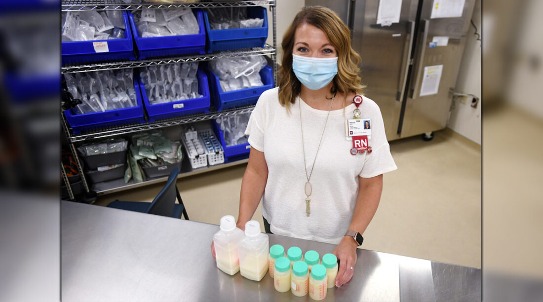 Nurse Nicole Geist stands in front of pasteurized donor milk in milk lab at Riley Children's Hospital.