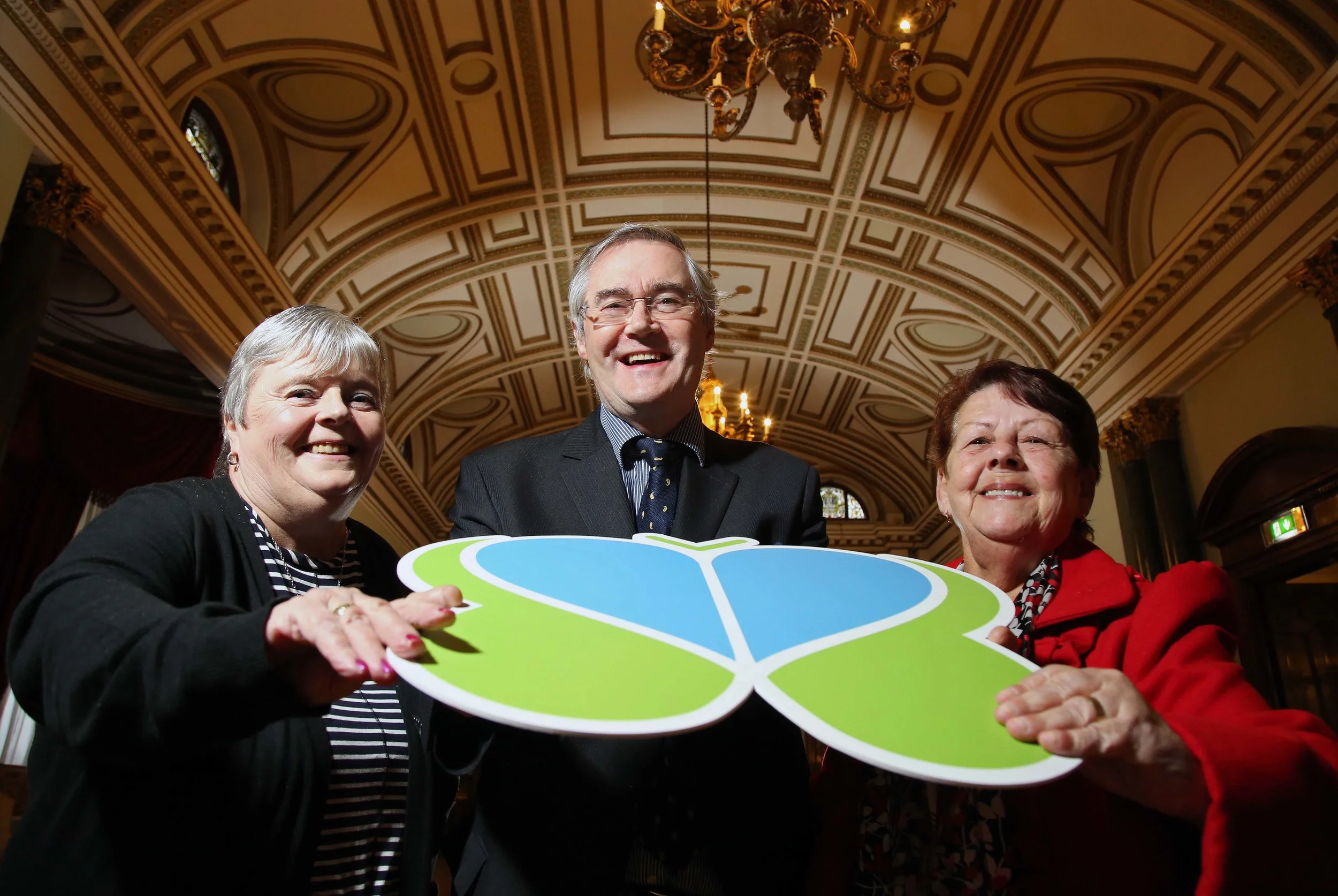 Pictured with Dr Eamon Phoenix are Brain Injury Matters service users Margaret Kinnard and Jean Mc Veigh.