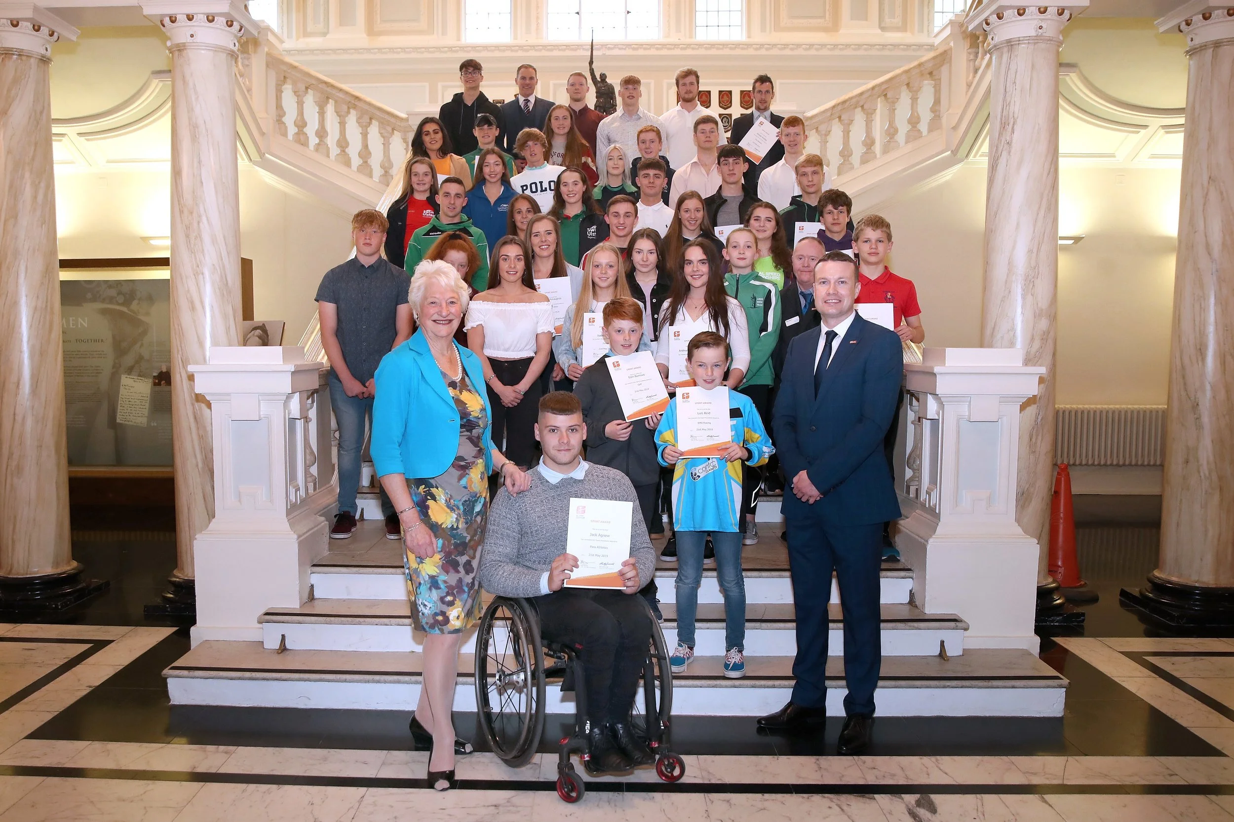 Lady Mary Peters, and GLL Regional Community Sports Manager Ronan McKenna with the GLL Sport Foundation Awards winners at Belfast City Hall last night.