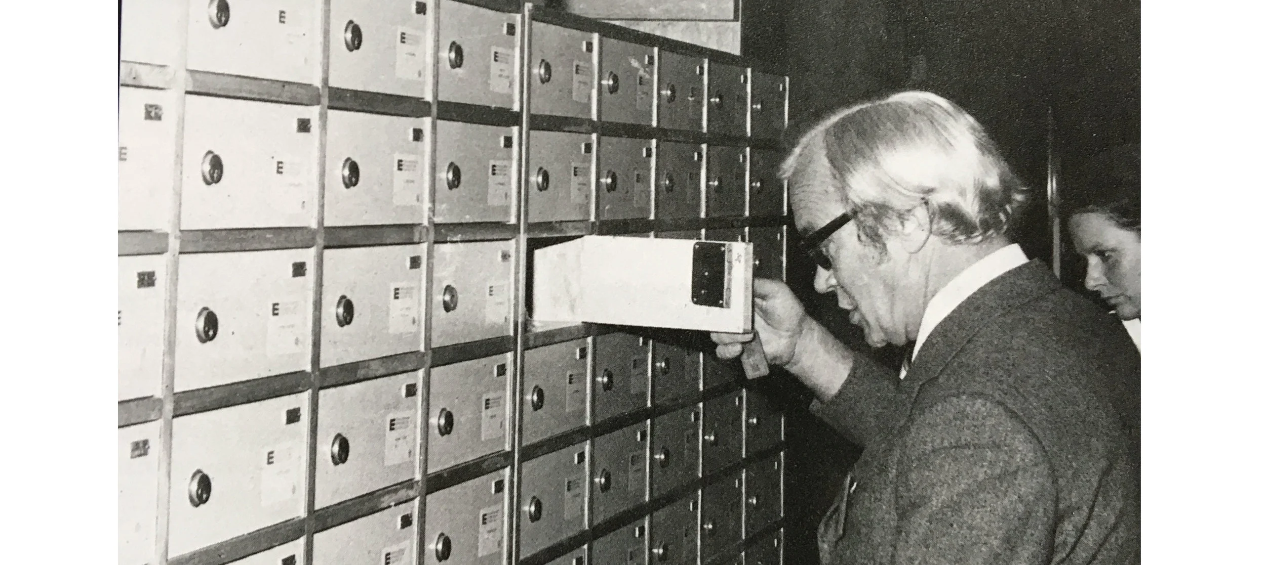 A participant checking his pigeon hole during the annual meeting.