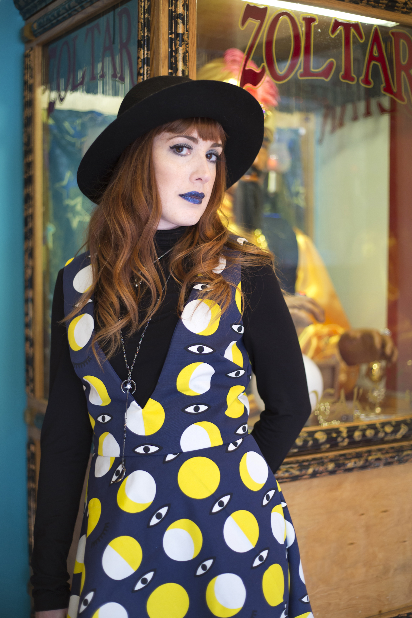 Kayla Morgan Beavers wearing Carina Lopez Design inside of Side Show Sweets photographed by Studio Misha_1.JPG