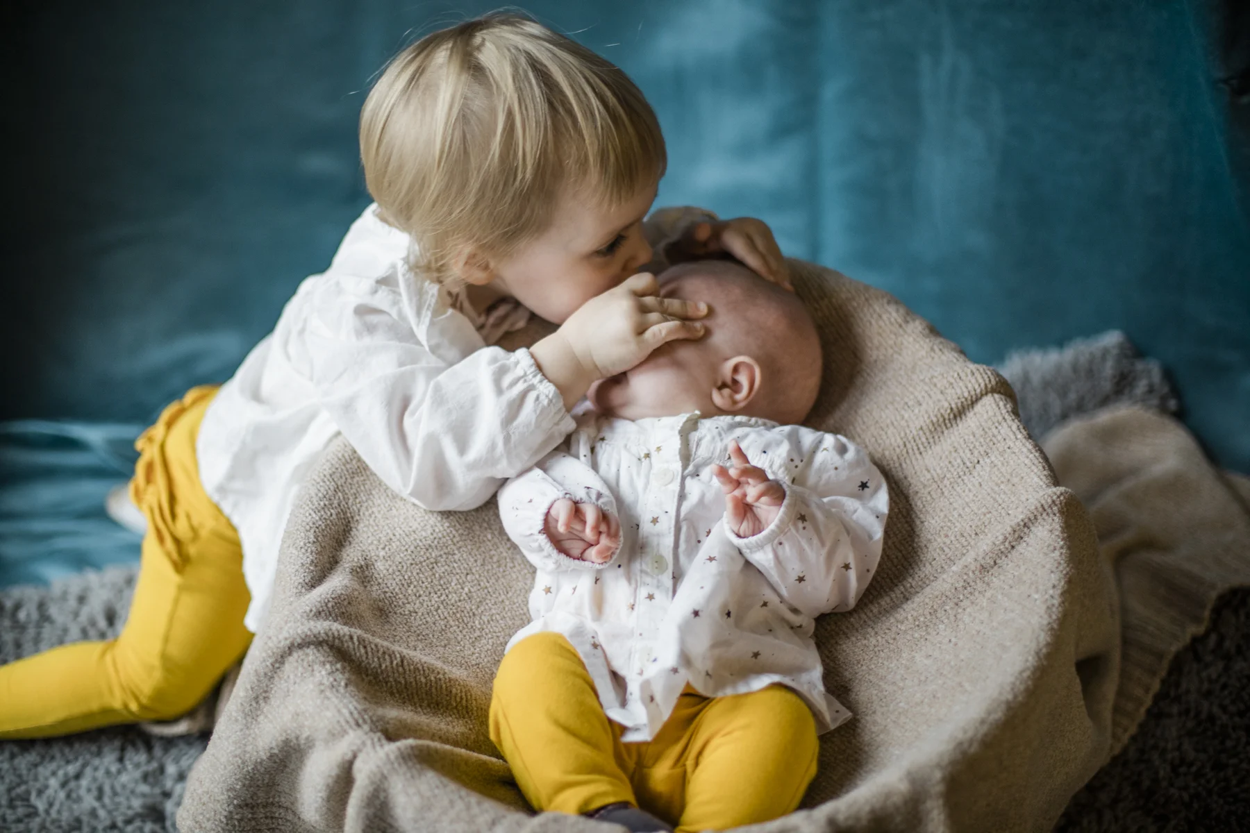 Sweet kiss for baby sister