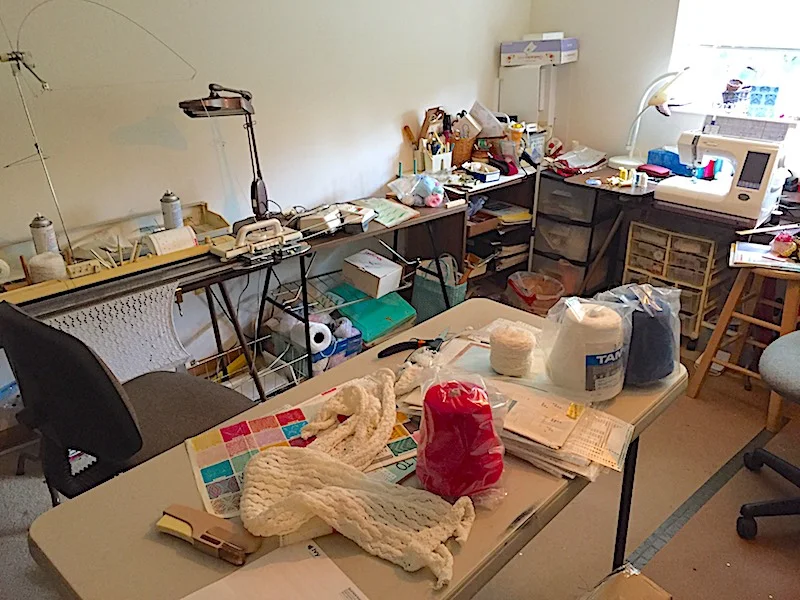 Alice Buckley does her needlepoint magic in this well-stocked room.