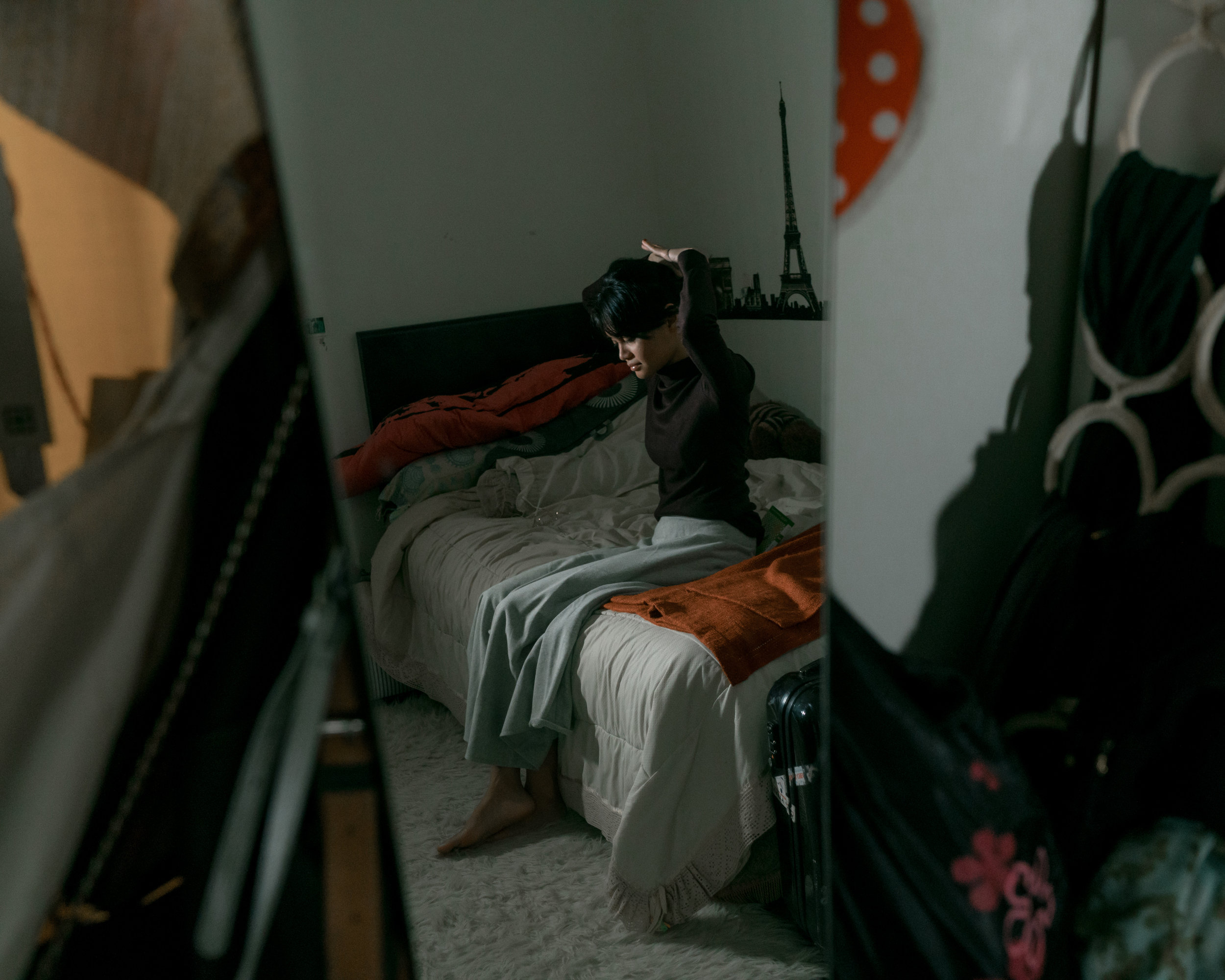 Spending time at her room while she prepared herself to leave the room for a family dinner