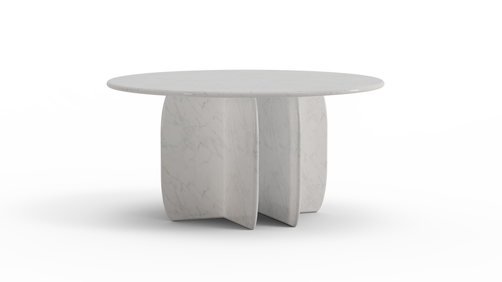 Elegant round dining table in white marble with sculptural base, blending timeless material with modern form.