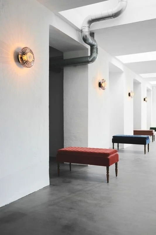 New wave Optic Light sconce in hallway- Marie Burgos Collection.jpeg