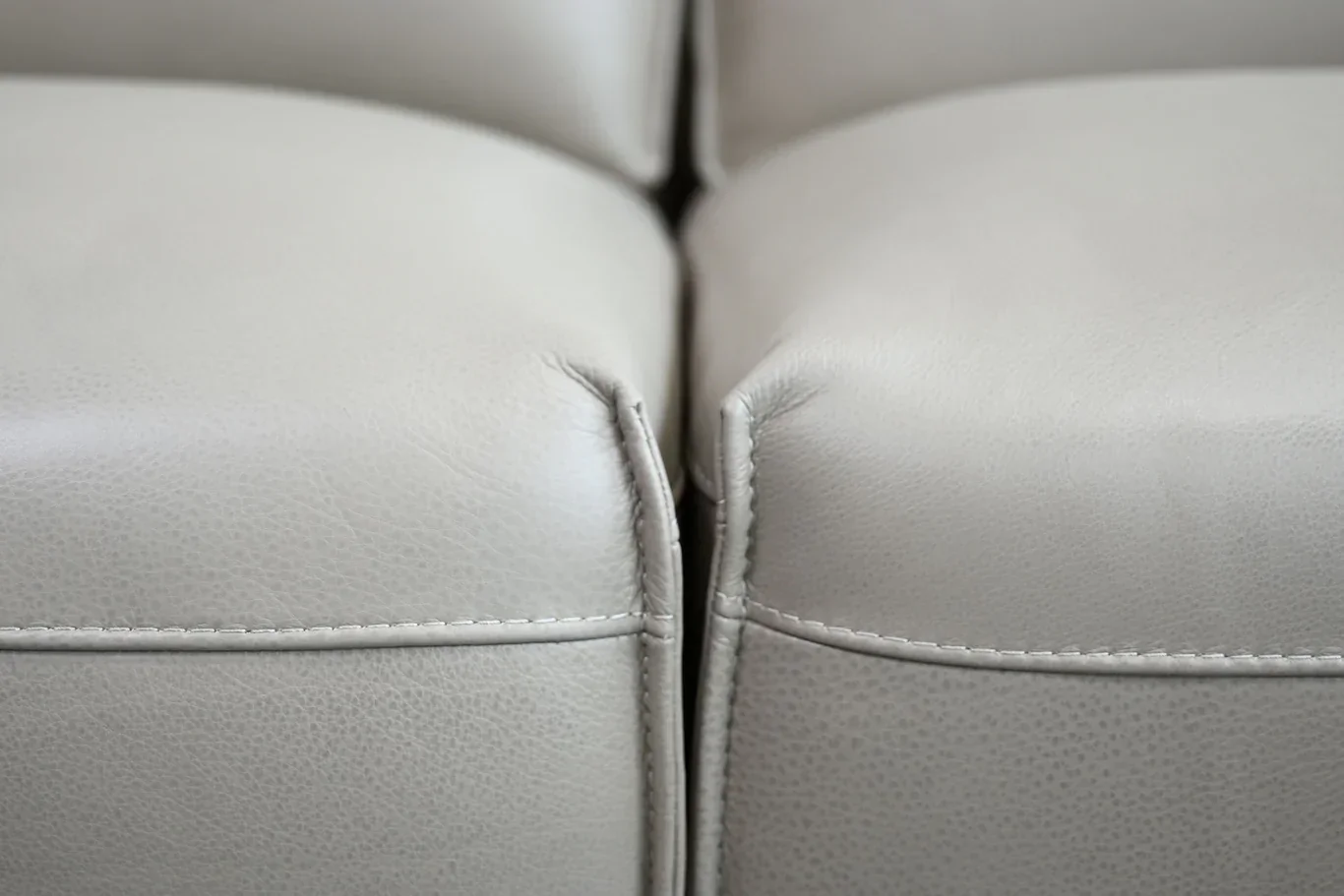 close-up-of-studio-taupe-full-grain-semi-aniline-leather-on-boone-sectional-sofa.png.webp
