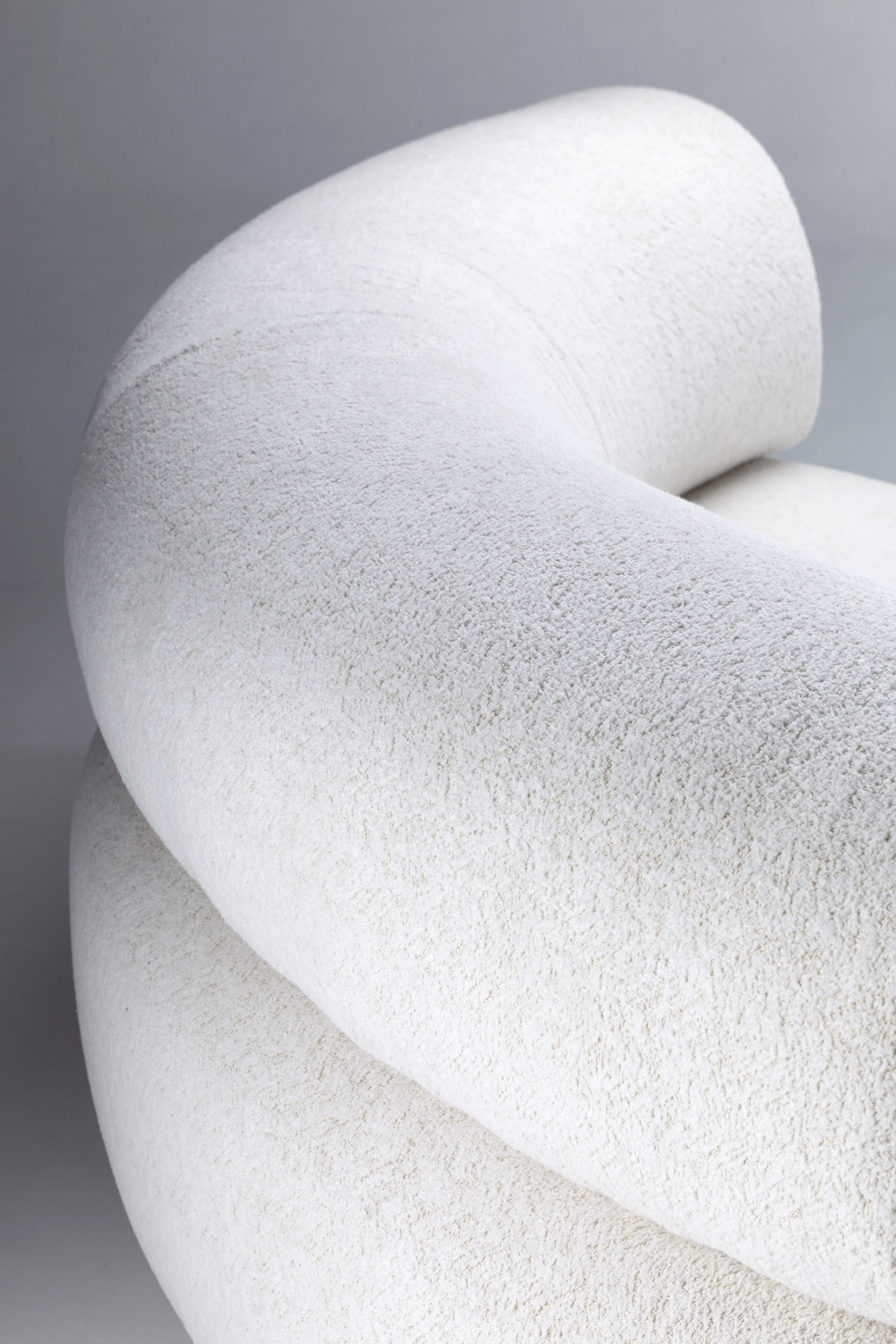 Close-up of the premium textured bouclé upholstery on the Carmel 2-piece sofa, illustrating the plush comfort and artisan finish.