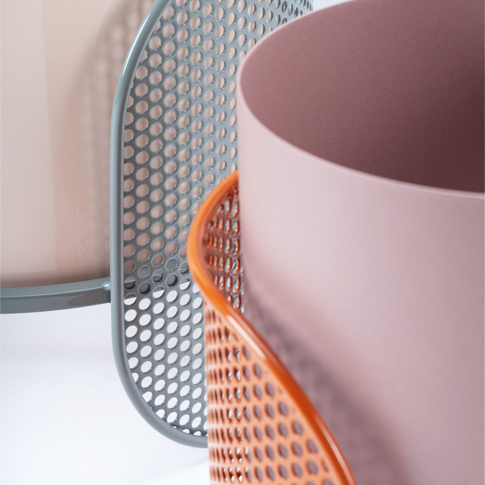 Close-up detail of perforated metal base on Riviera vase, highlighting craftsmanship and material contrast.