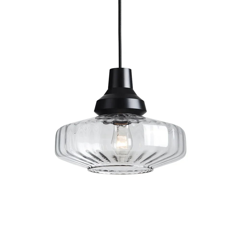 Marie Burgos Collection New Wave Optic Pendant Light featuring hand-blown clear textured glass with a ripple pattern and a black fabric cord.