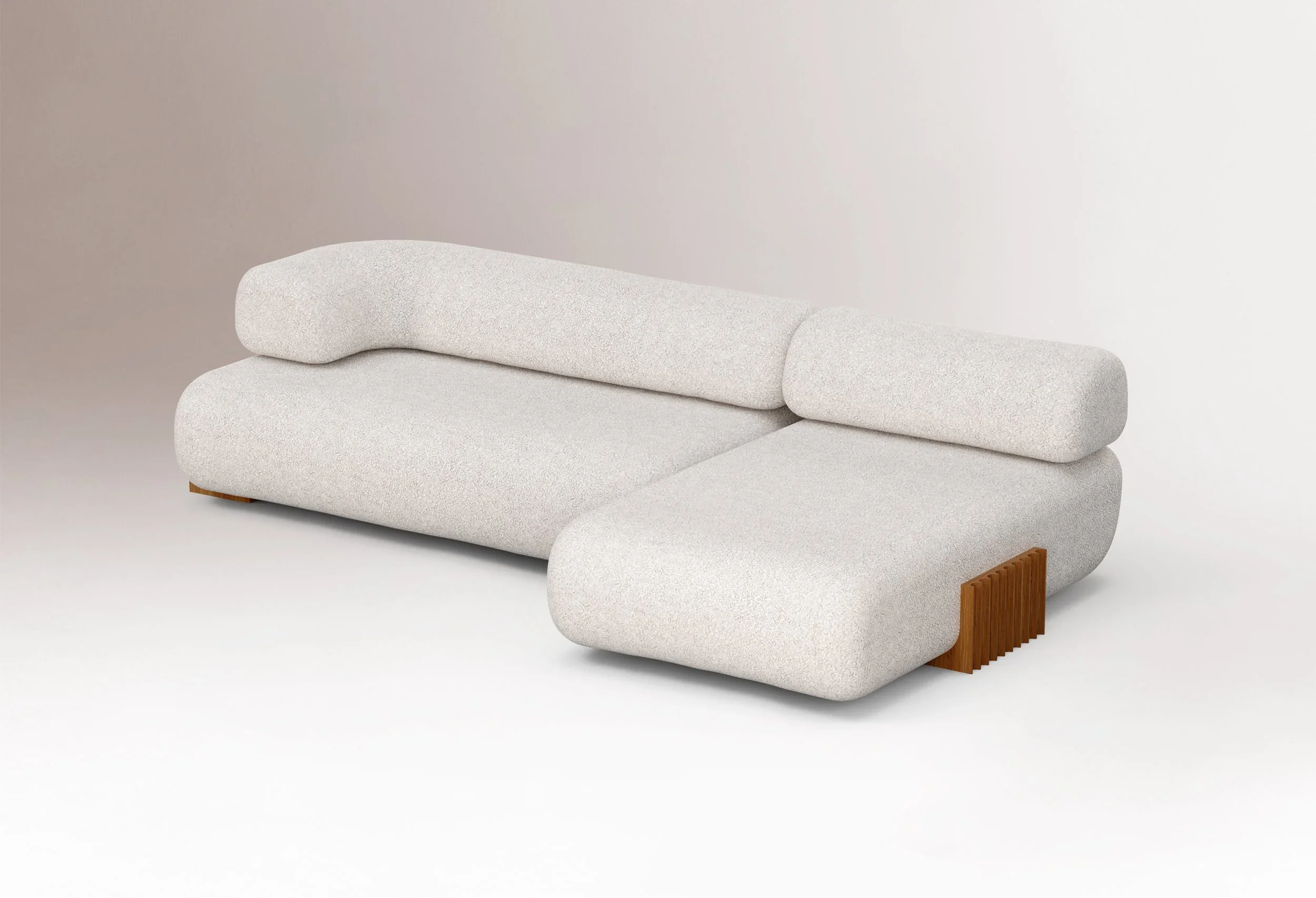 Carmel Modular Sofa with Chaise in a luxury neutral fabric, featuring a low-slung modernist silhouette and deep-seated lounging from Marie Burgos Collection.