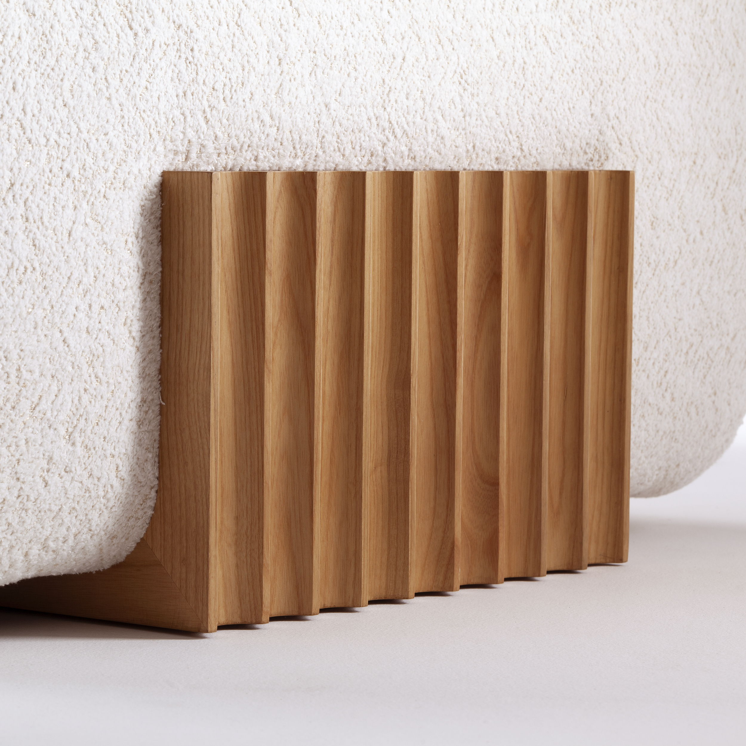 Close-up of the premium textured bouclé upholstery on the Carmel 2-piece sofa, illustrating the plush comfort and artisan finishes.