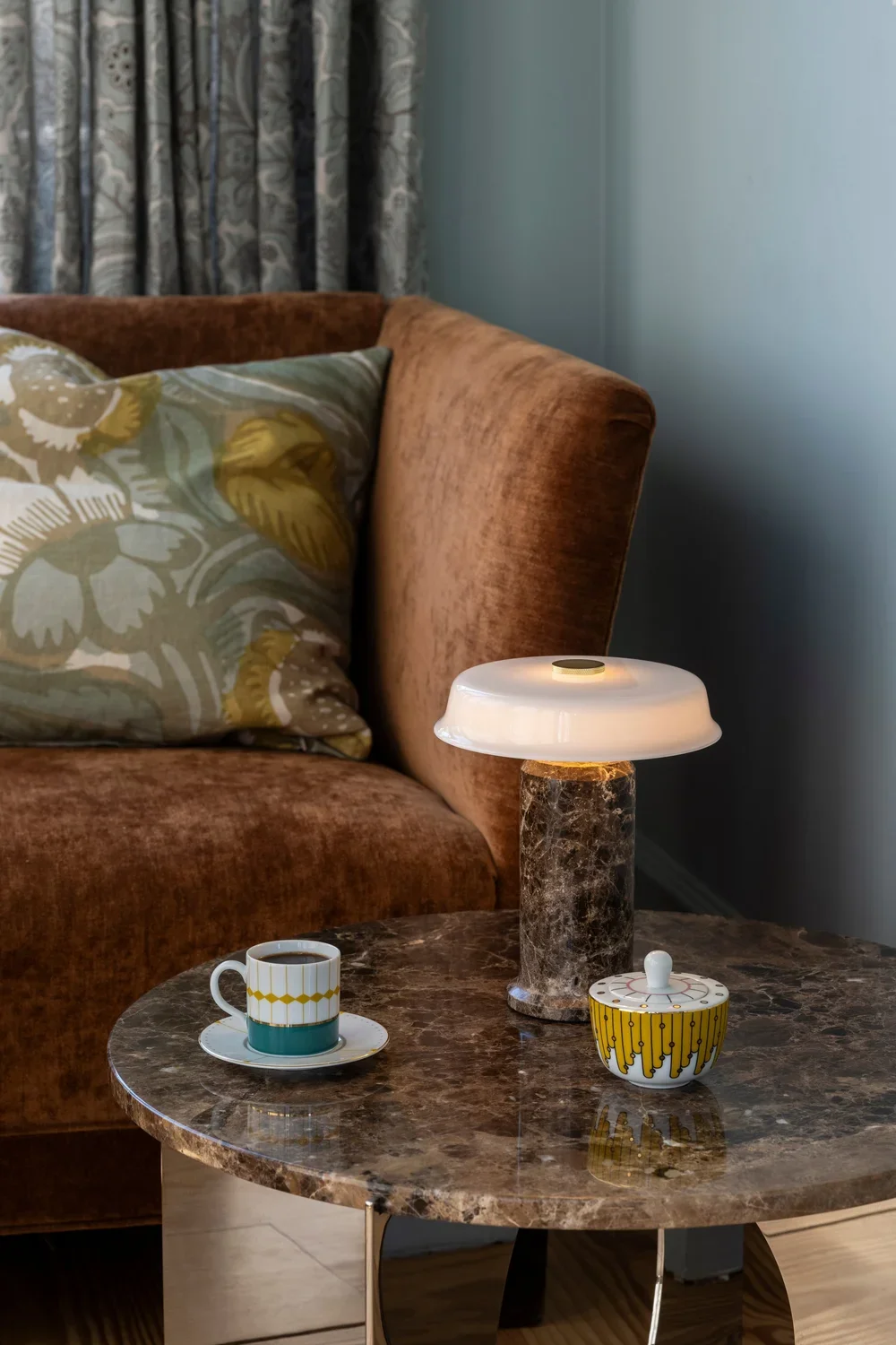 Dark marble table with dramatic marble lamp