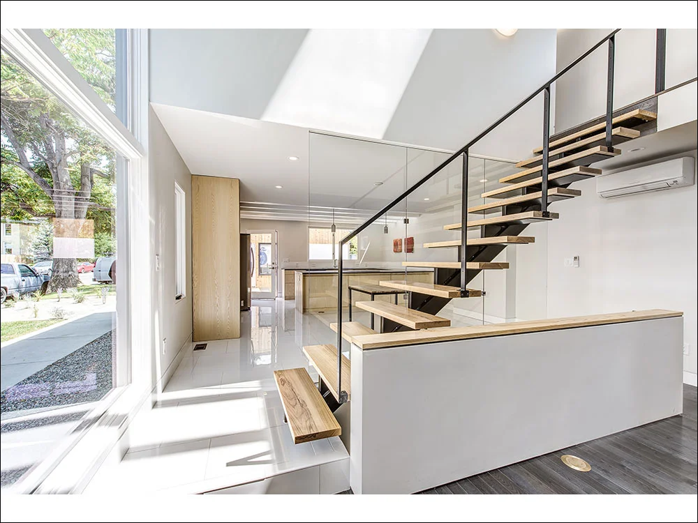 Custom kitchen and main staircase fabricated by PAPER AIRPLANE