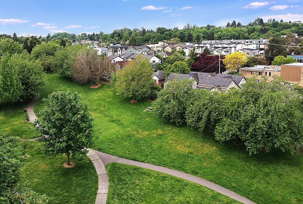  An aerial view of the park and walkway that takes you to this unique townhouse community, built in the heart of the Columbia City Landmark District. 