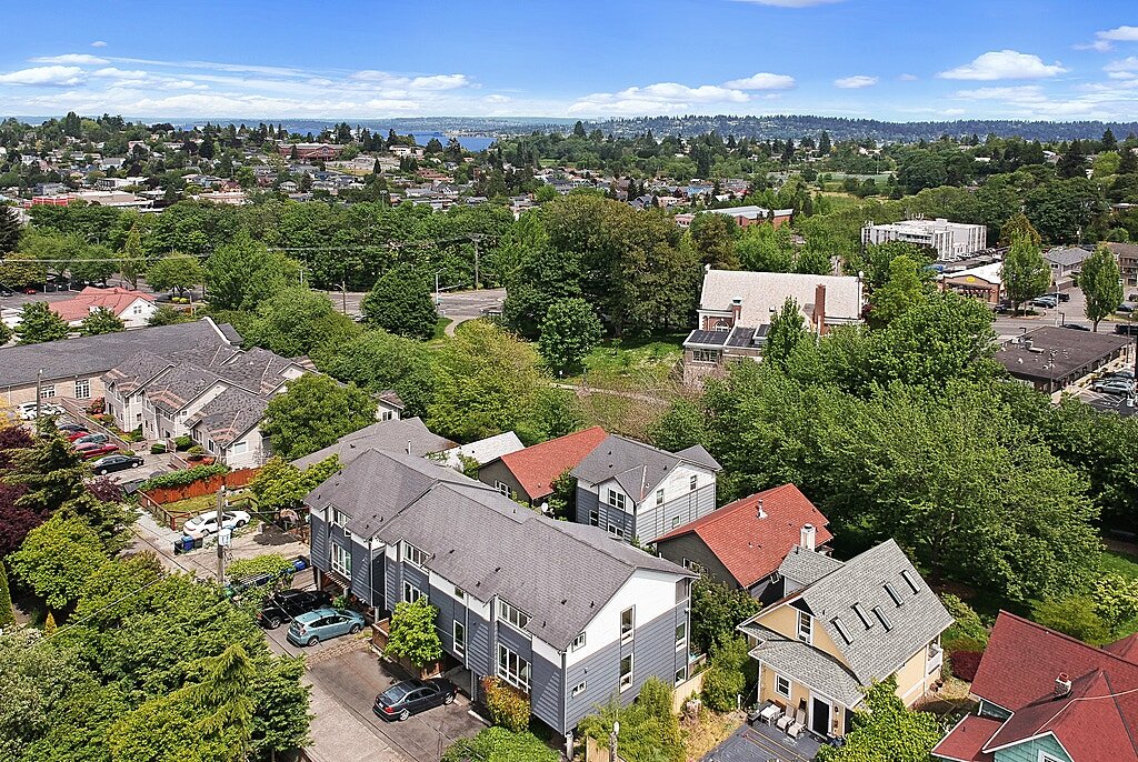  A drone shot to capture the neighborhood, you are a 25 min walk to Lake Washington. The home is the SW corner unit. 