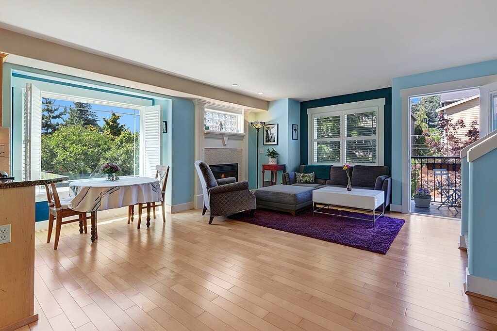  Not your average townhouse, the home has lovely hardwood maple floors and wood shutters on the windows in the main living space. Lots of room for different layouts and a lovely patio just off the dining room. 