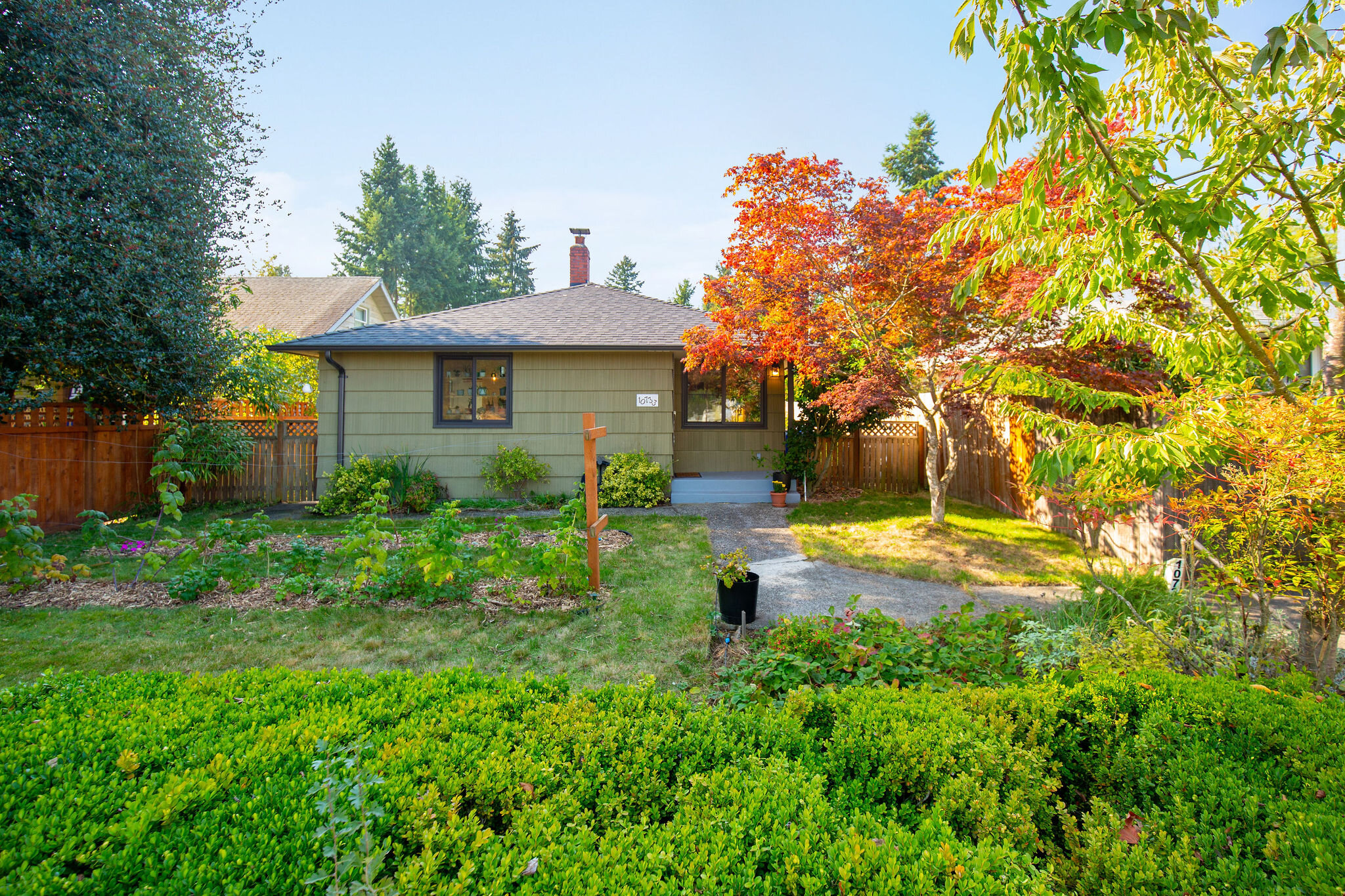  Generous lot with an ability to access the house from Whitman (up off the street) or down the alley in the back with off-street parking and a garage. 