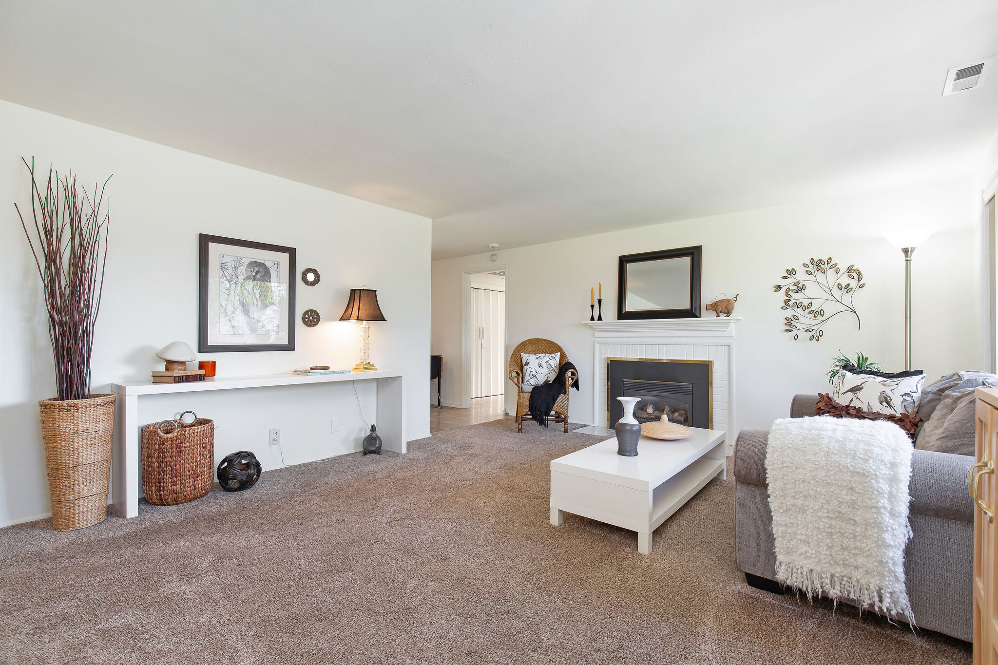  Spacious living room with new carpets in 2016 and a gas fireplace to keep the place toasty in the winter. 