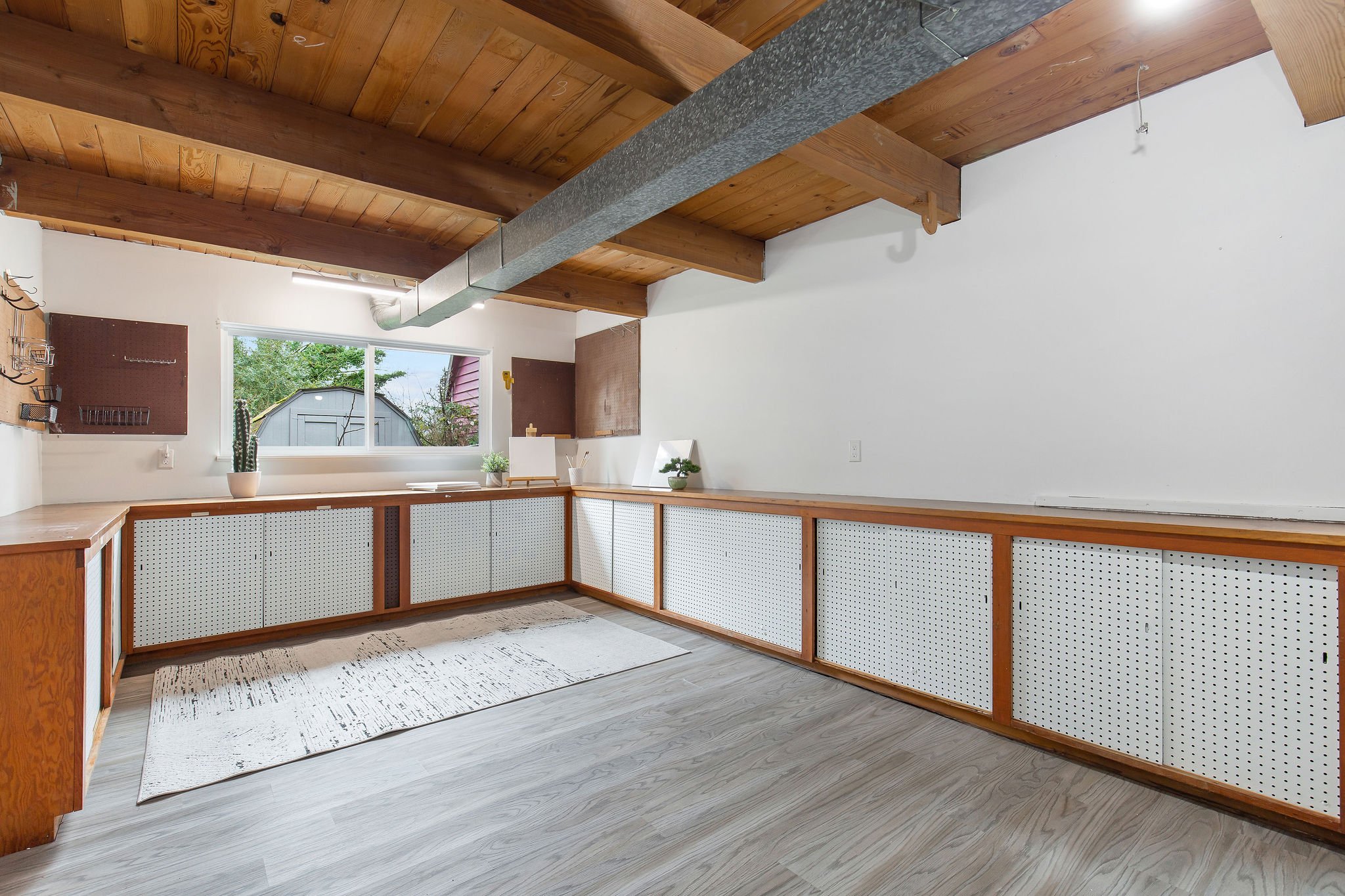  image description: interior of garage with wooden countertops and window 