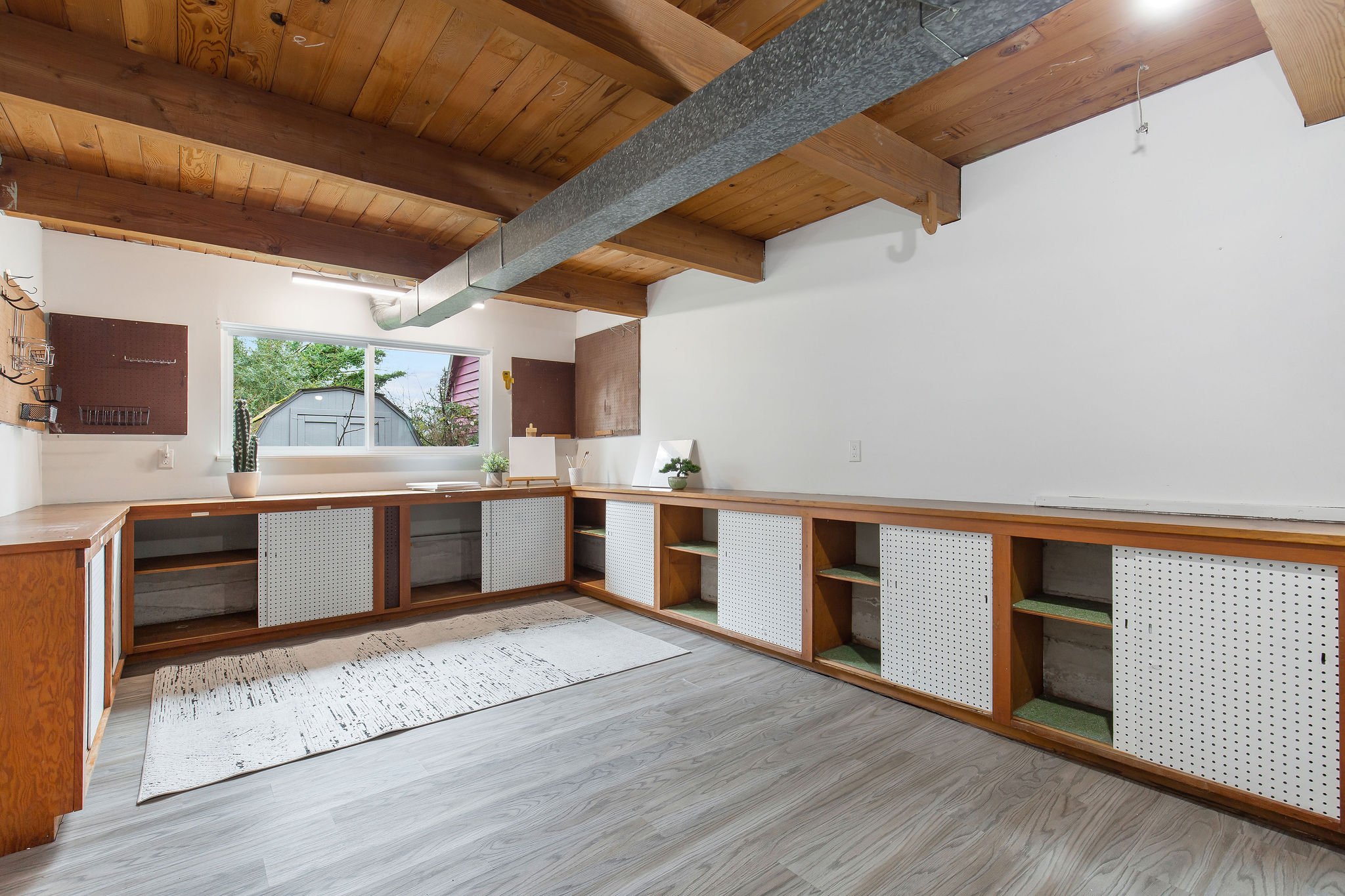  image description: interior of garage with wooden countertops and window 