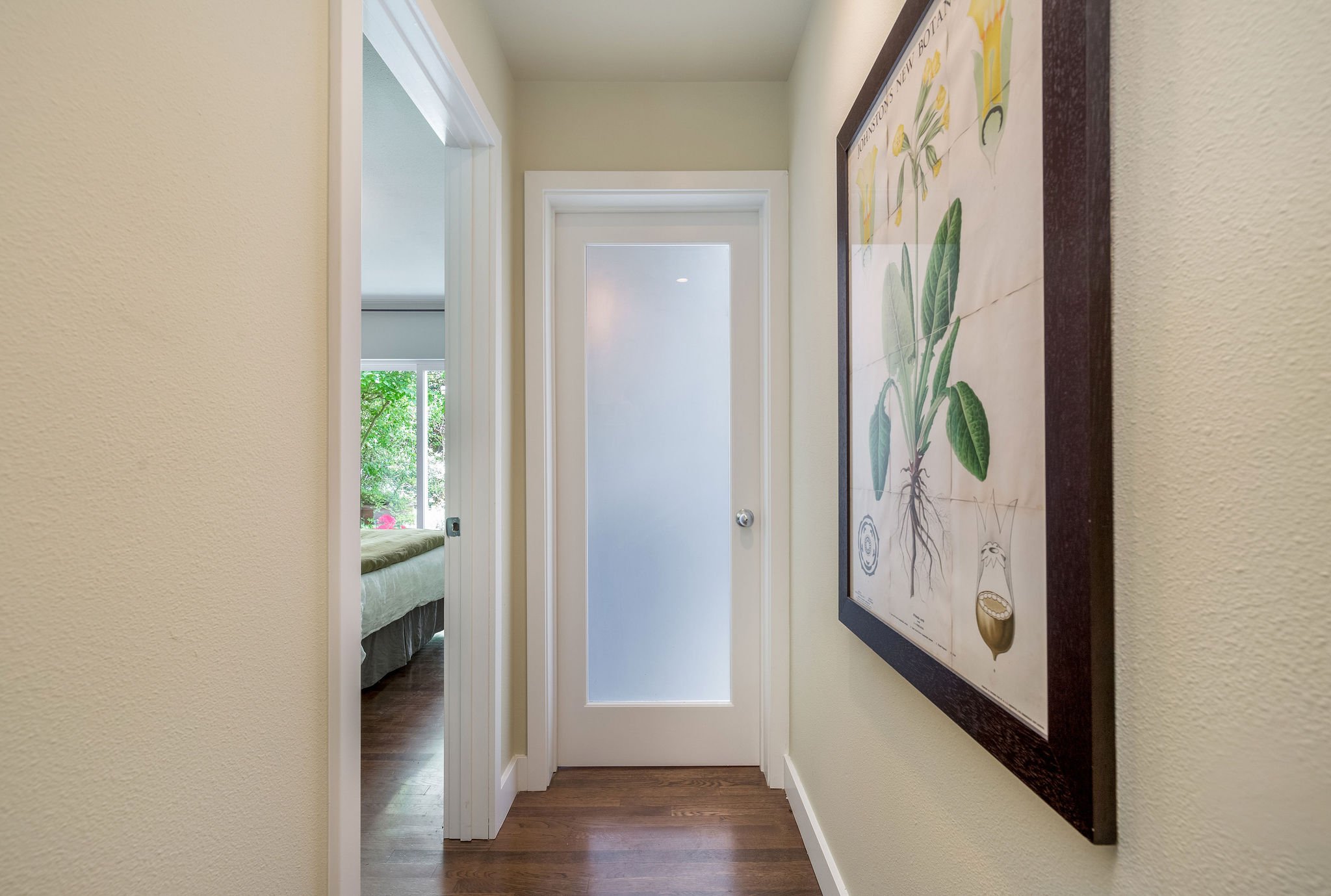  image description: interior of hallway with frosted glass door 
