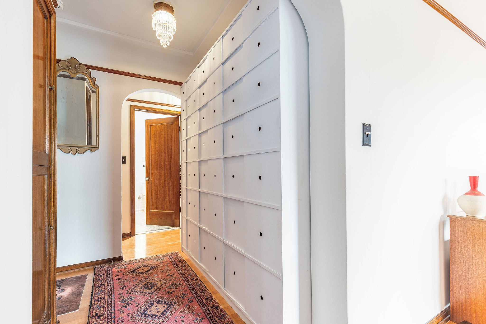 This home has ample storage with 8 closets and cabinets. Period detail includes mahogany doors, trim and molding, oak floors and octagonal fluted glass doorknobs. 